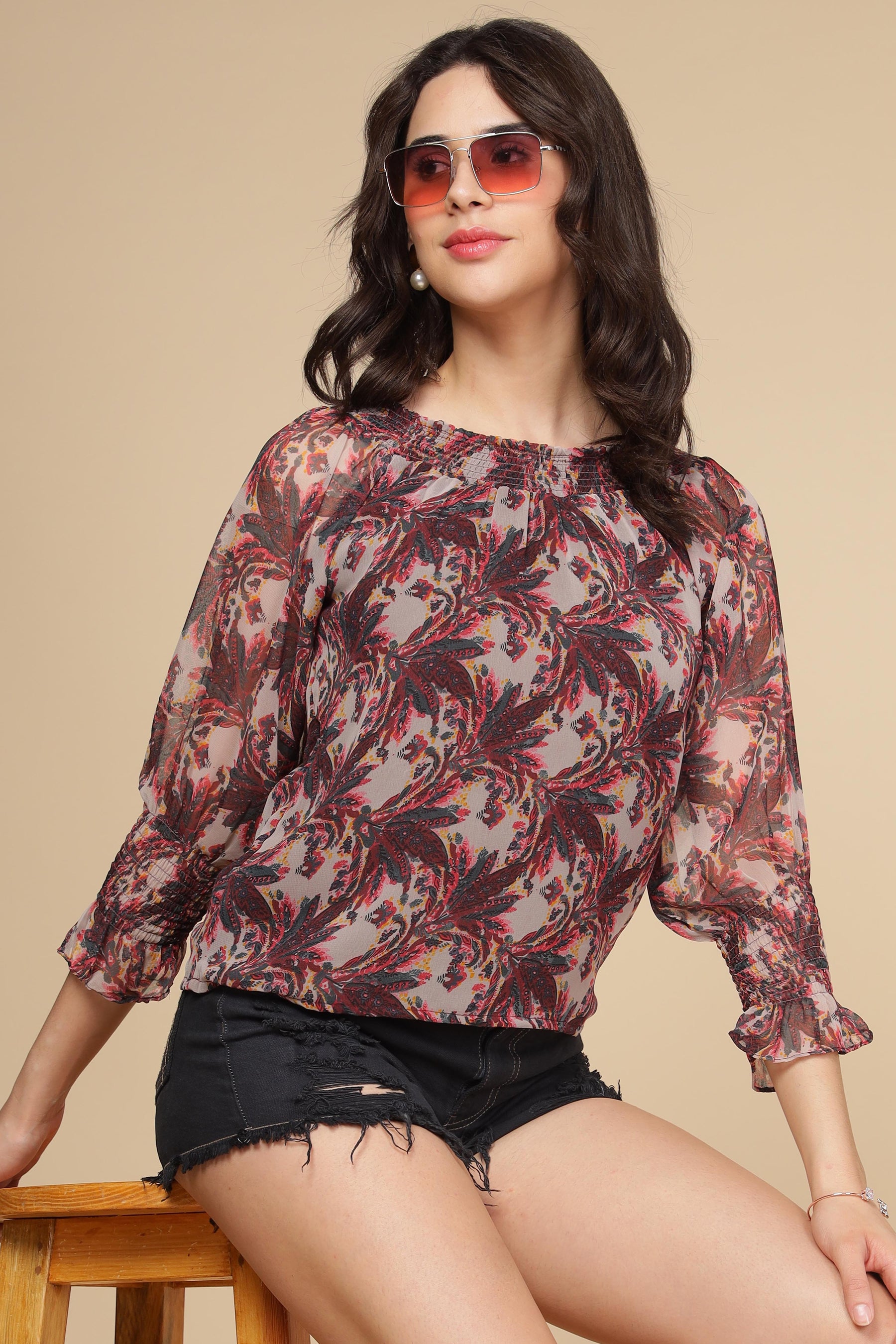 Multi off-shoulder top with floral design and stylish sleeves.