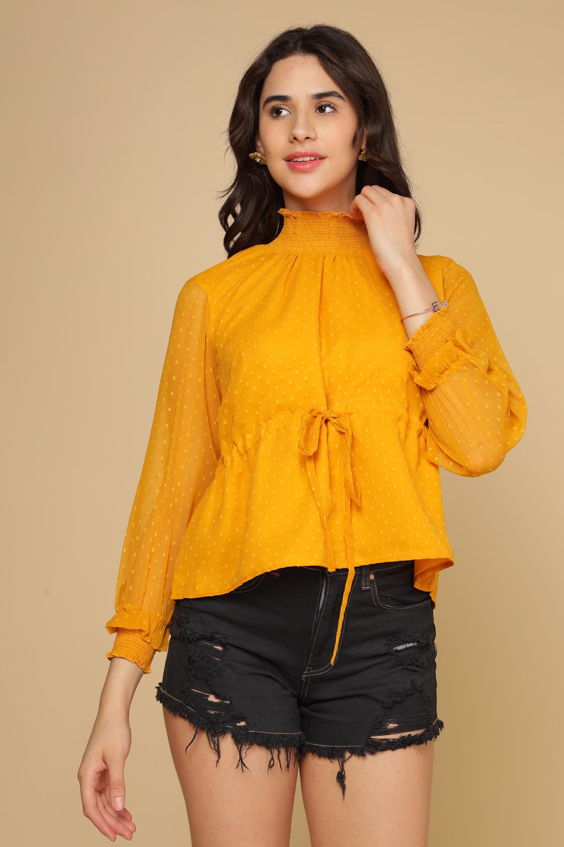 Bright yellow chiffon top with tie detail and playful sleeves.