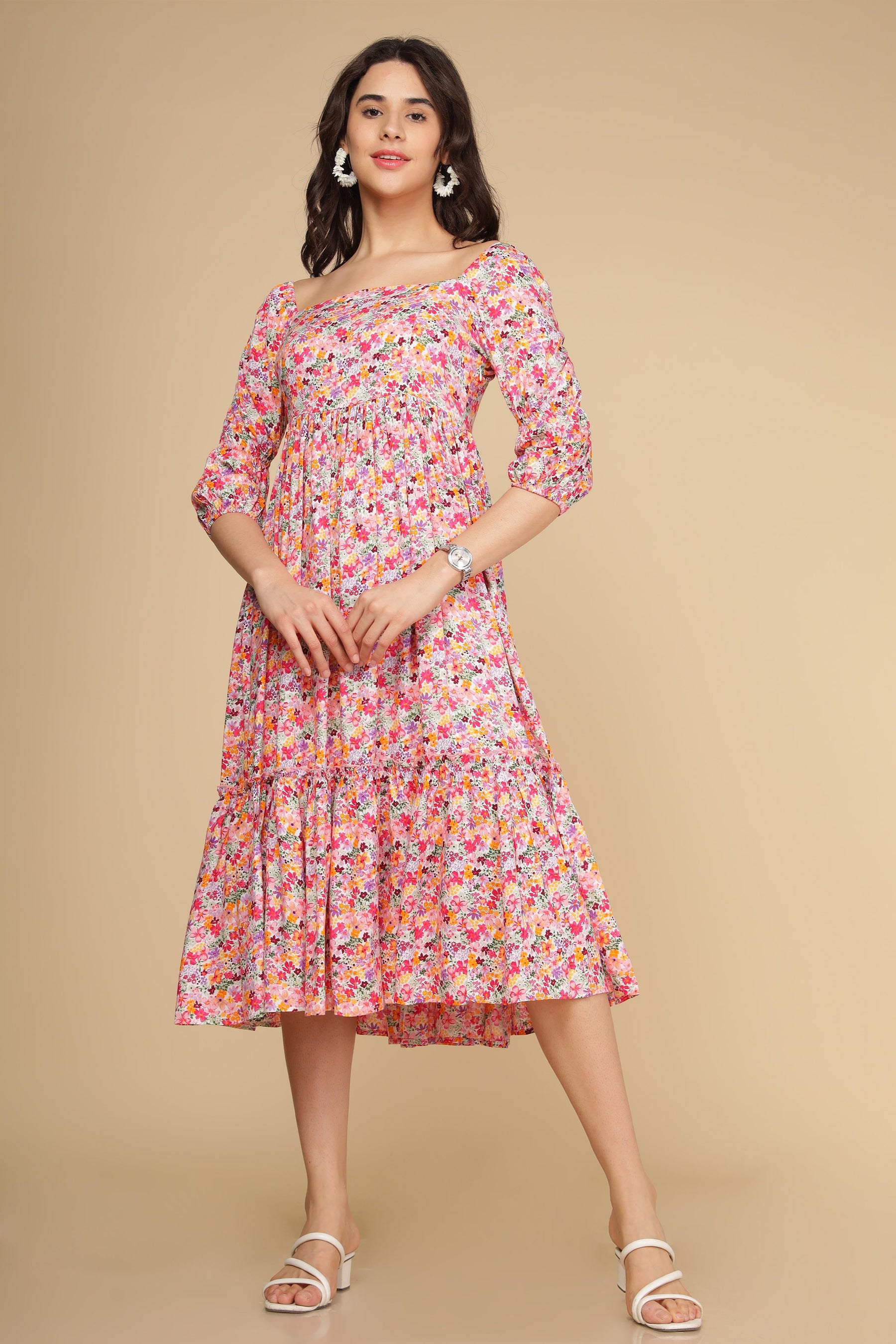 White floral cotton maxi dress with puff sleeves and tiered design.