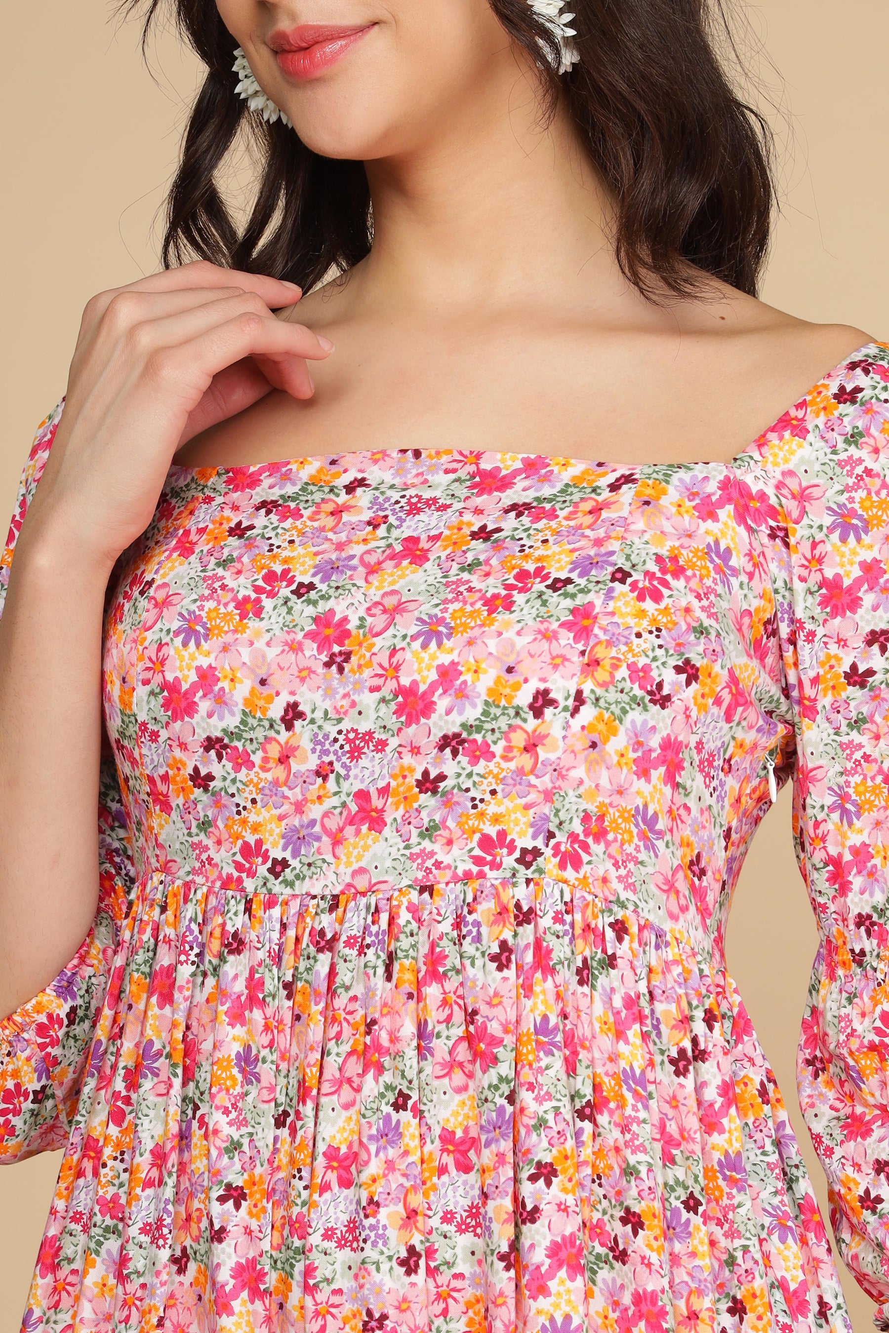 White floral cotton maxi dress with vibrant colors and off-shoulder design.