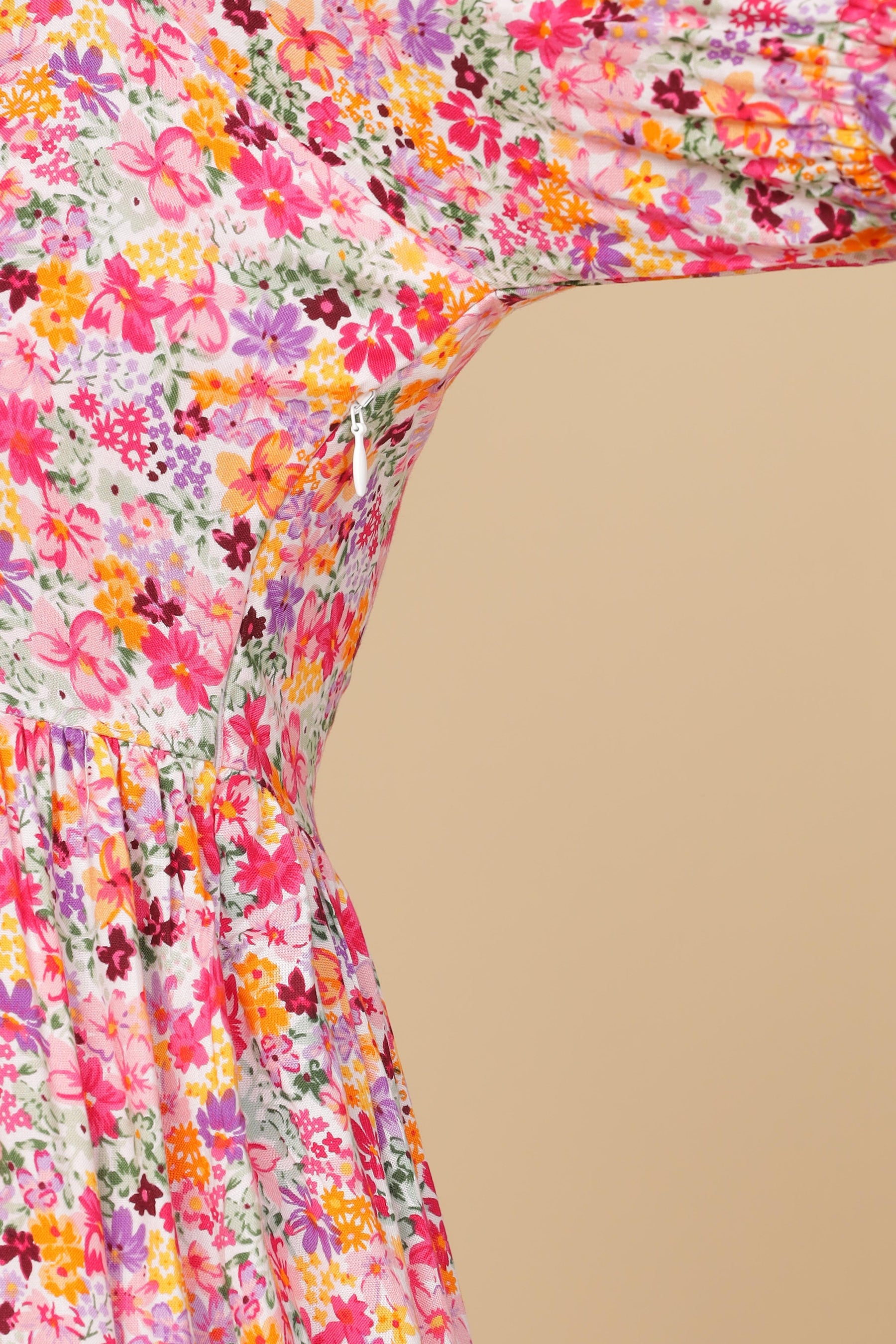White floral cotton maxi dress with vibrant pink and orange flowers.