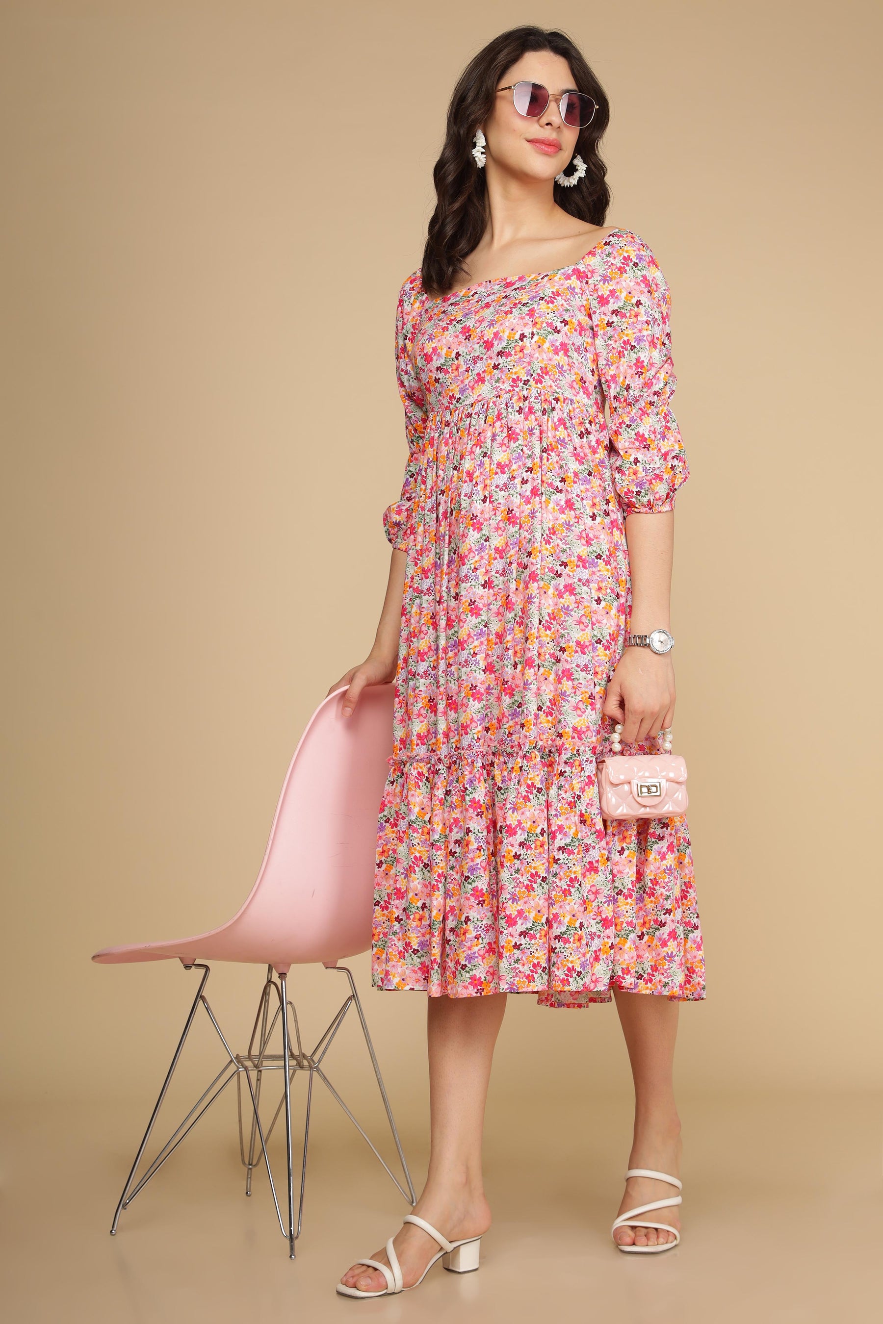 White floral cotton maxi dress on model with pink accessories.