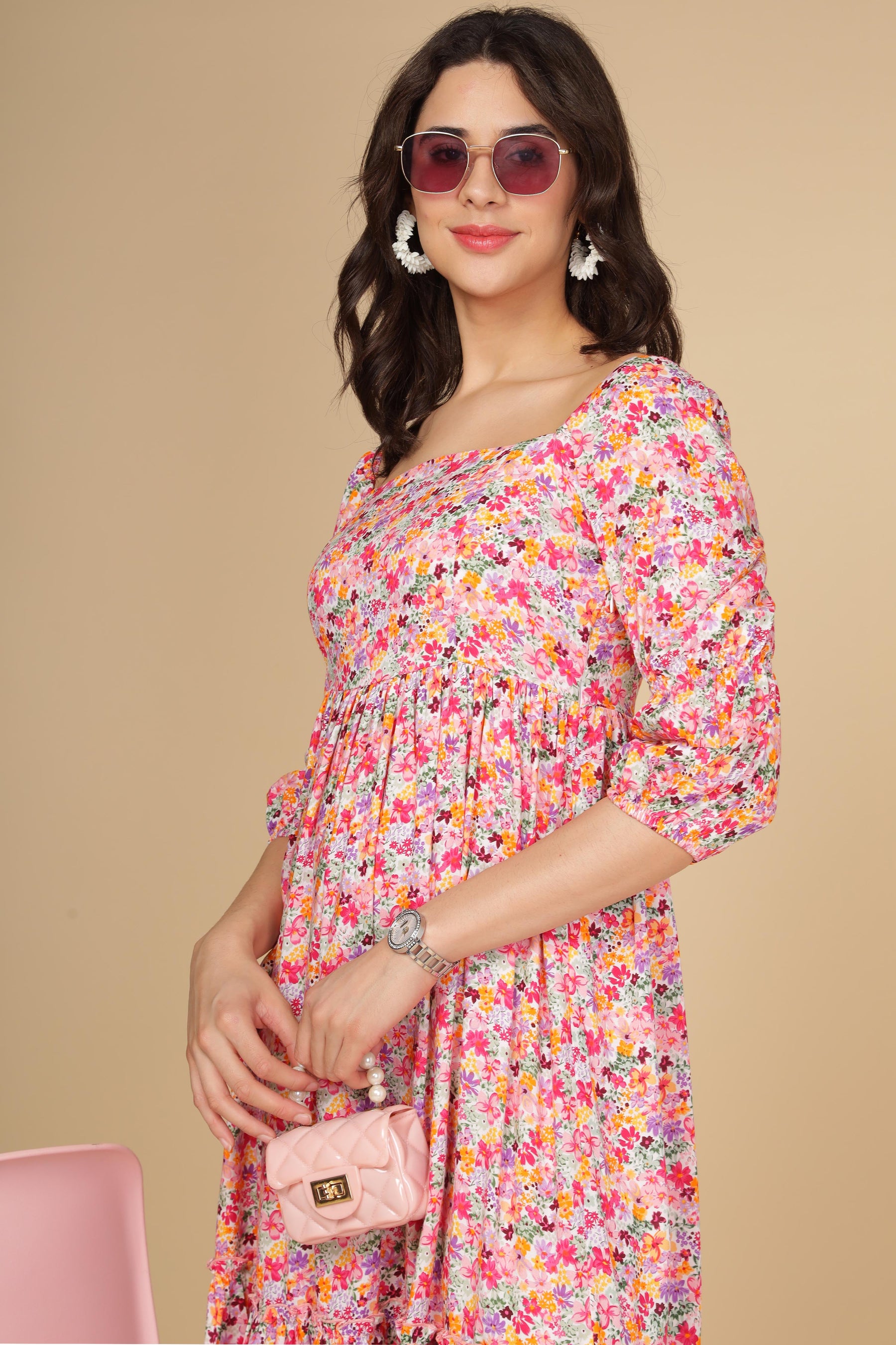 Fashionable model showcasing a white floral cotton maxi dress.