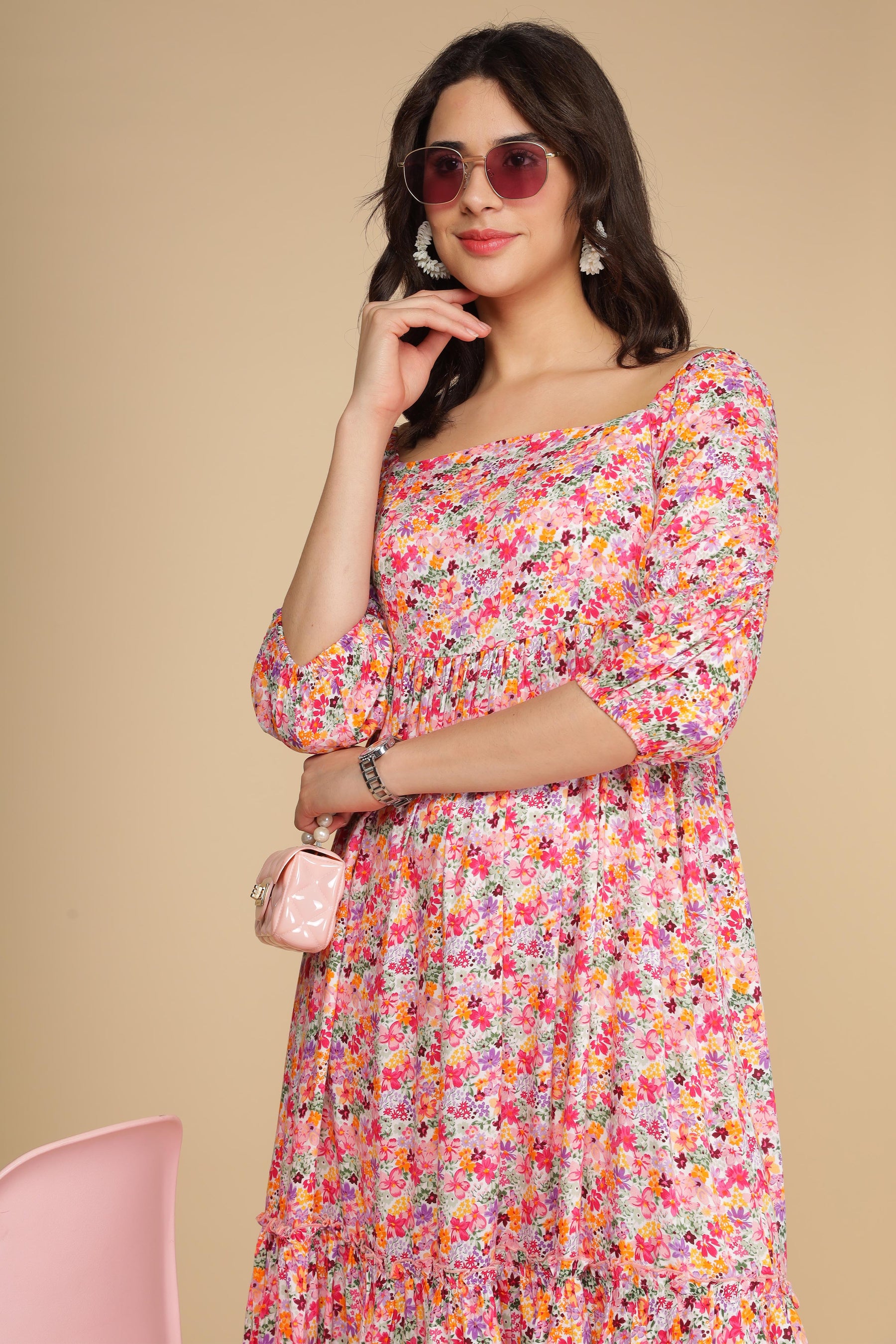 White floral cotton maxi dress with stylish accessories and soft background.