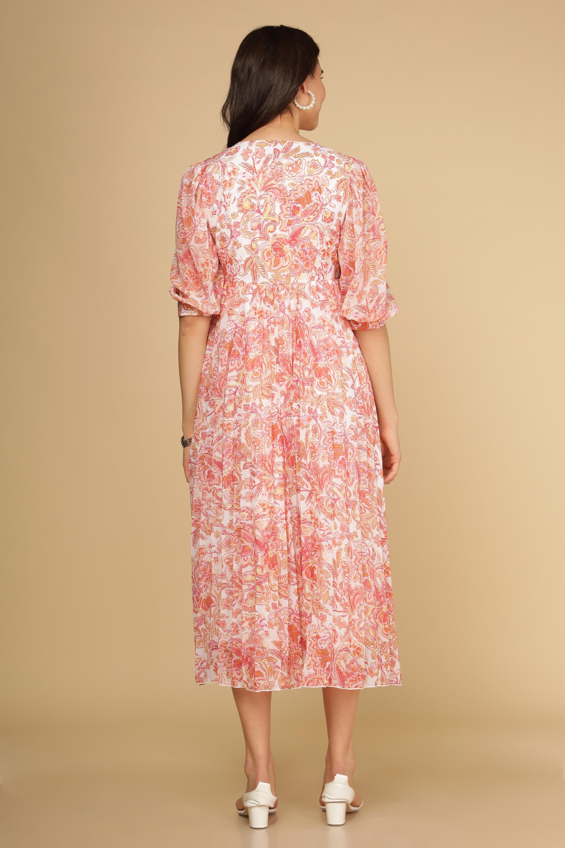 Back view of Pleated Motif Maxi dress in floral pattern.