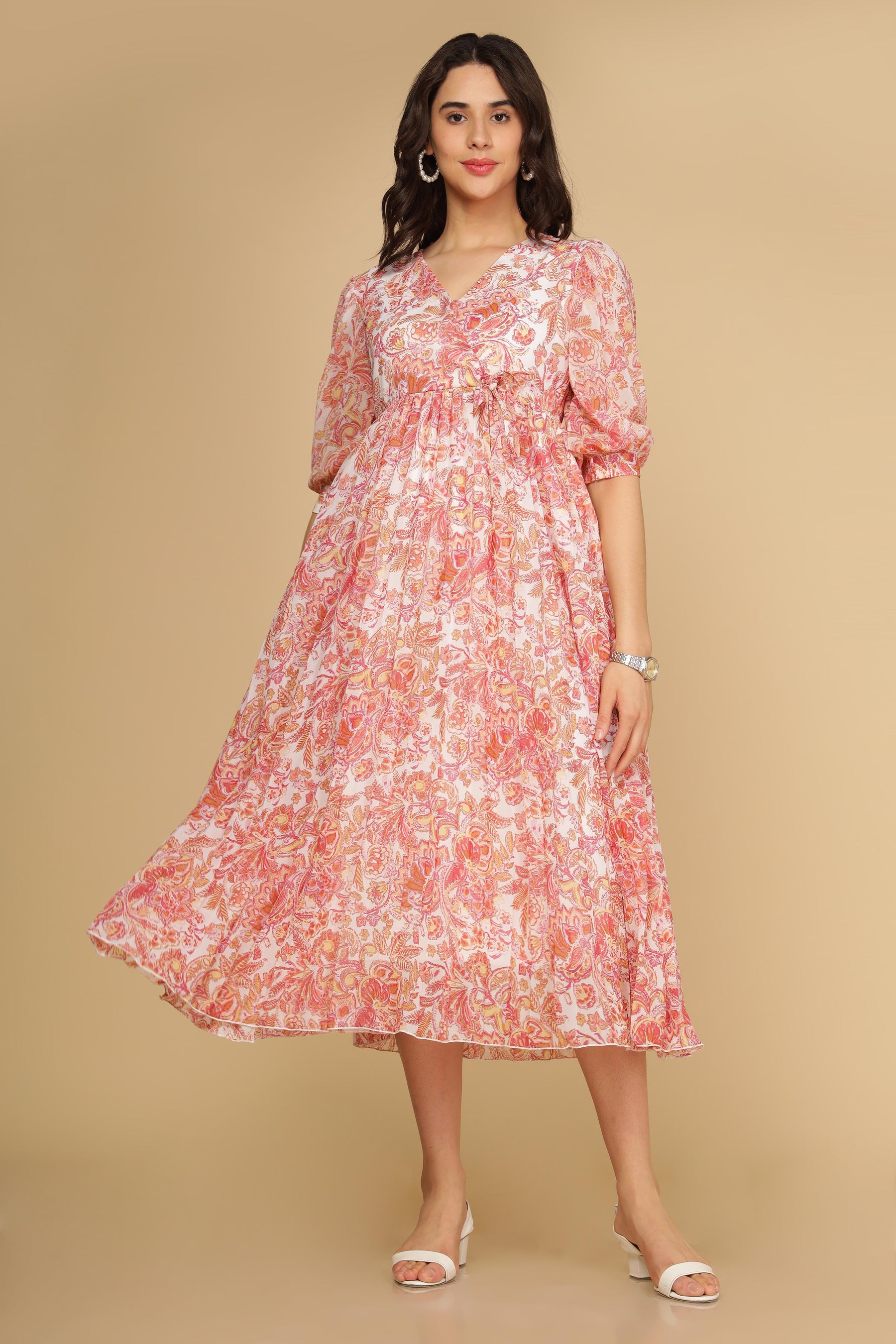 Floral pleated motif maxi dress in soft pink hues.