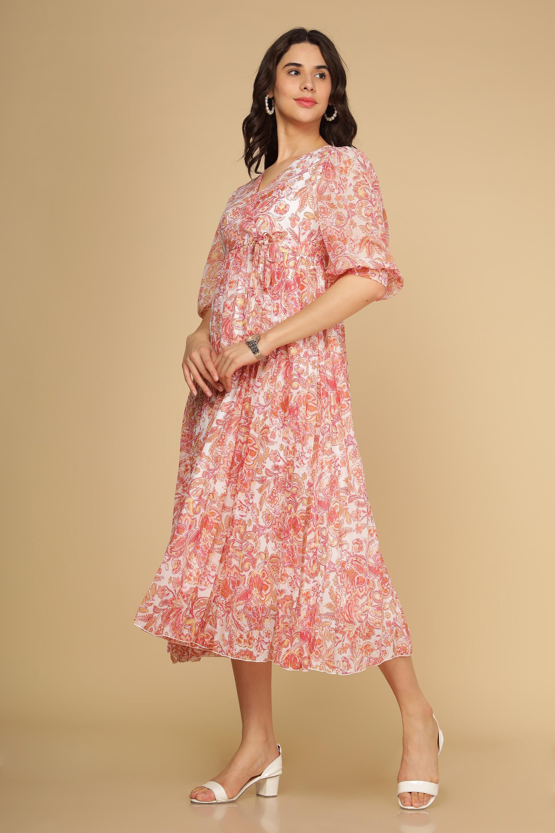 Pleated motif maxi dress in floral pink design for elegant styling.