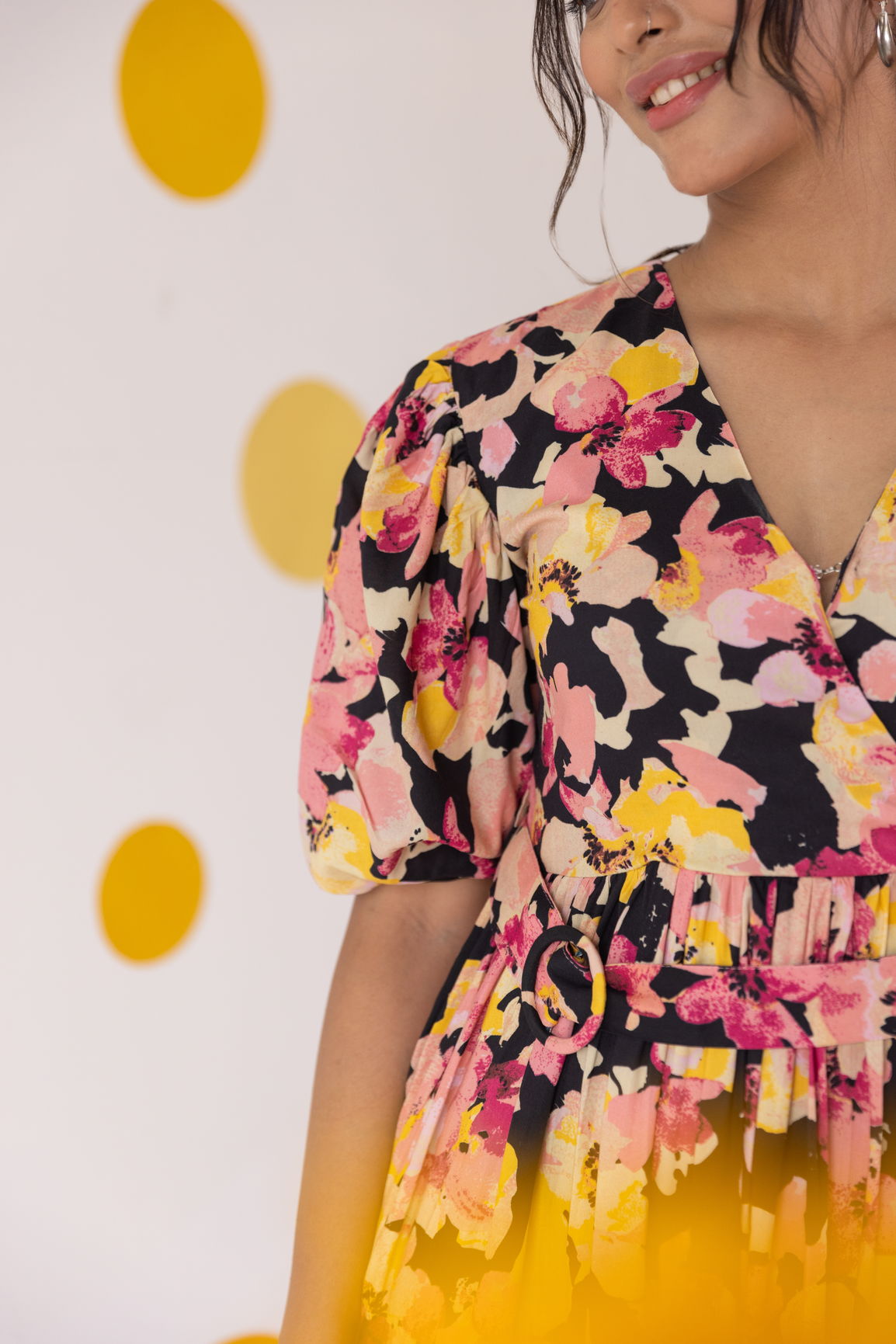 Big floral tiered cotton maxi dress with vibrant pink and yellow patterns.