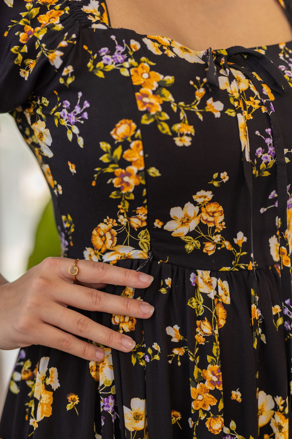 Black floral nursing maxi dress with yellow and purple flowers.