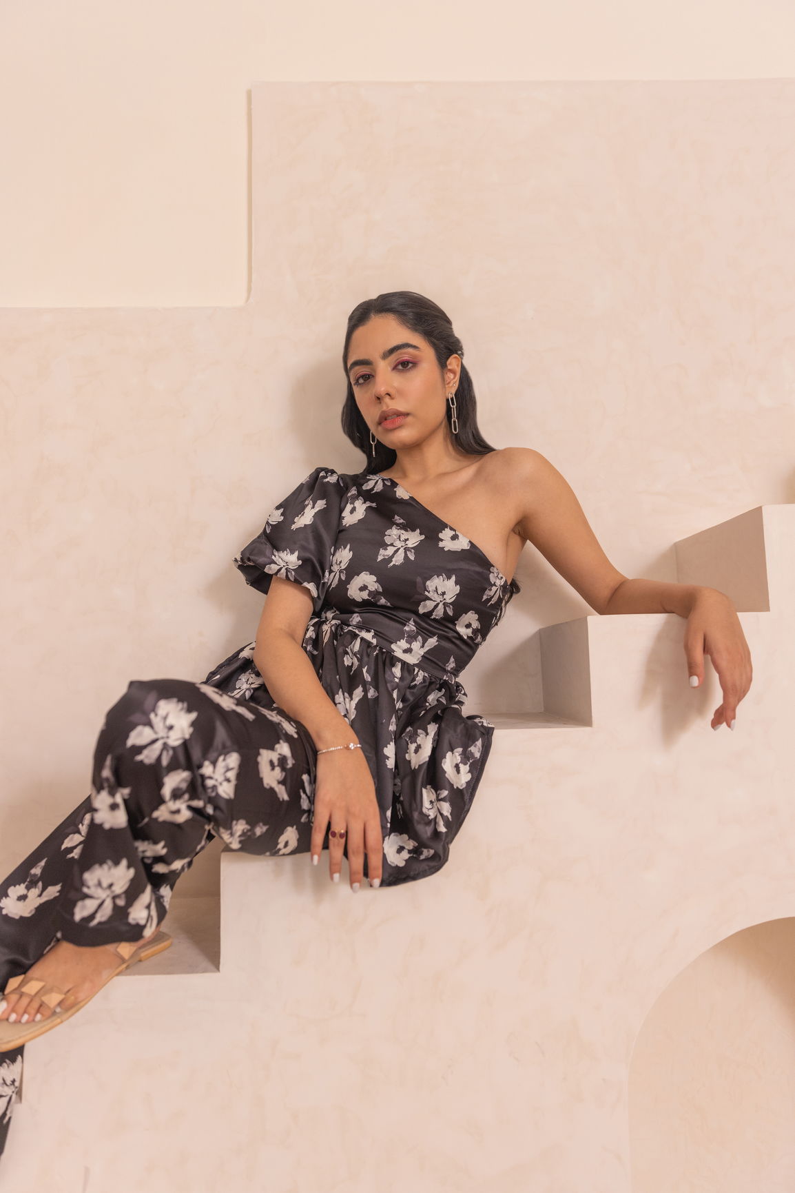 Black floral satin co-ord outfit showcased in stylish setting.