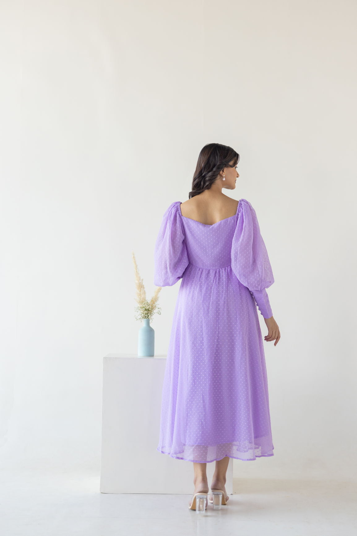 Elegant lilac maxi dress with puff sleeves, perfect for special occasions.