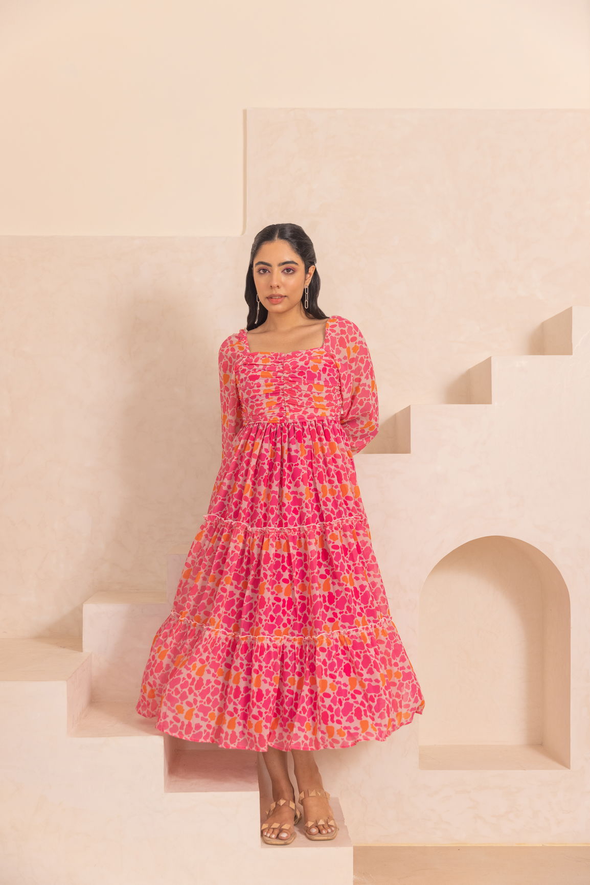Mosaic print maxi dress in vibrant pink patterns.