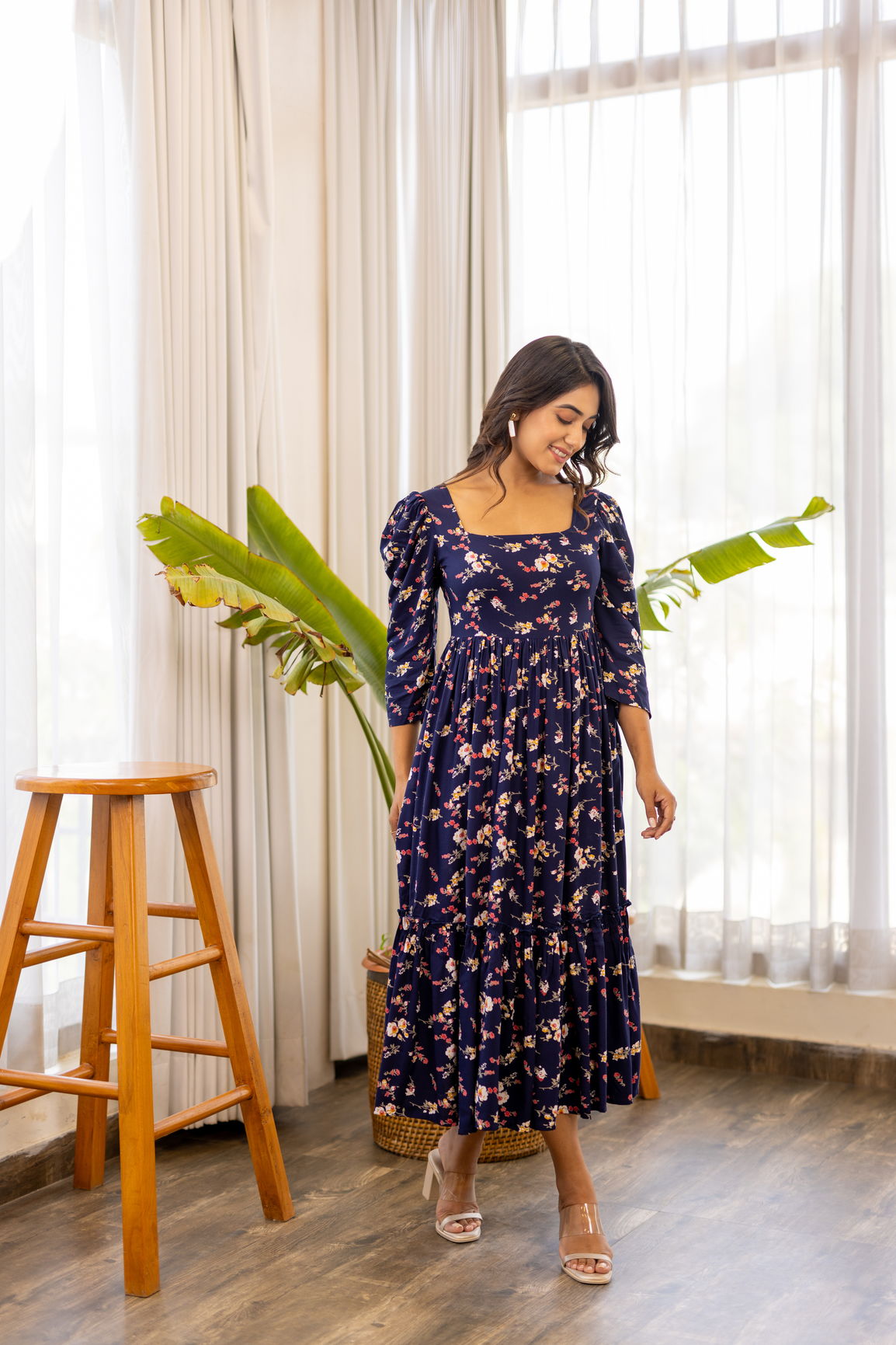 Navy blue floral maxi dress with stylish puff sleeves.