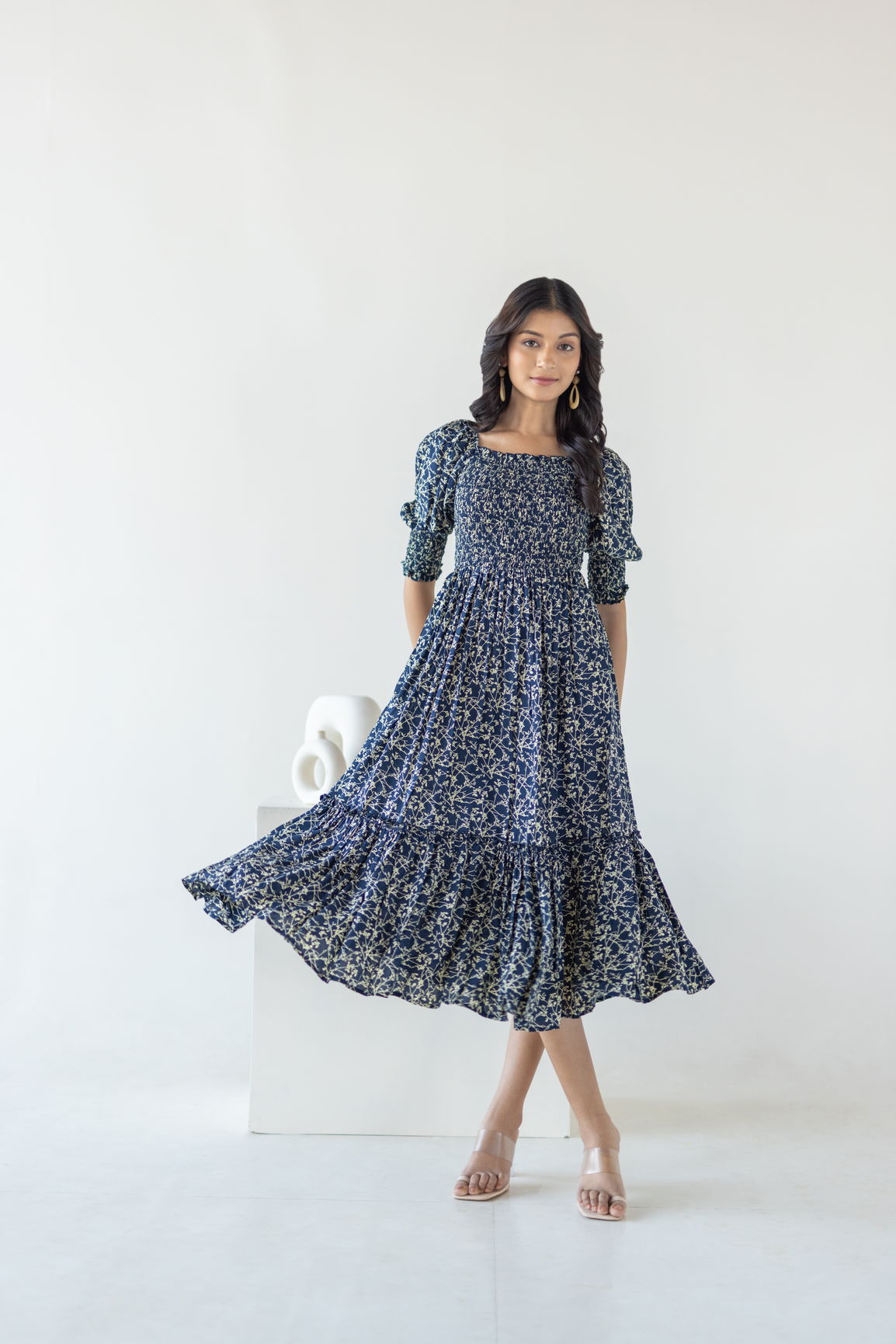 Navy mosaic cotton maxi dress modeled by a woman.