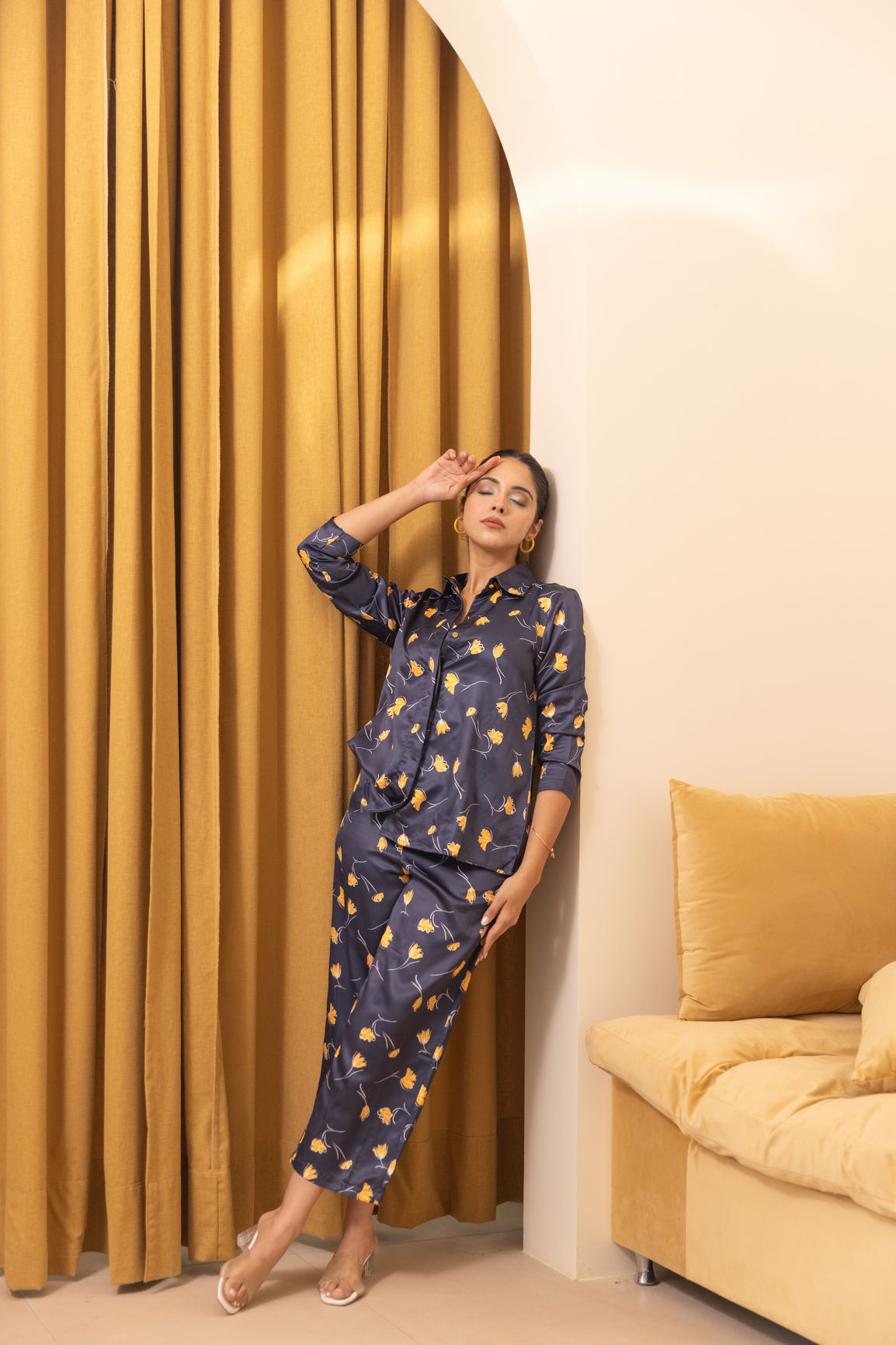 Navy satin co-ord set with floral pattern, elegant model pose.