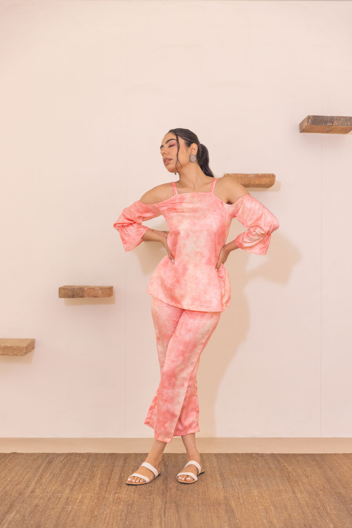 Peach off-shoulder co-ord set model posing stylishly indoors.