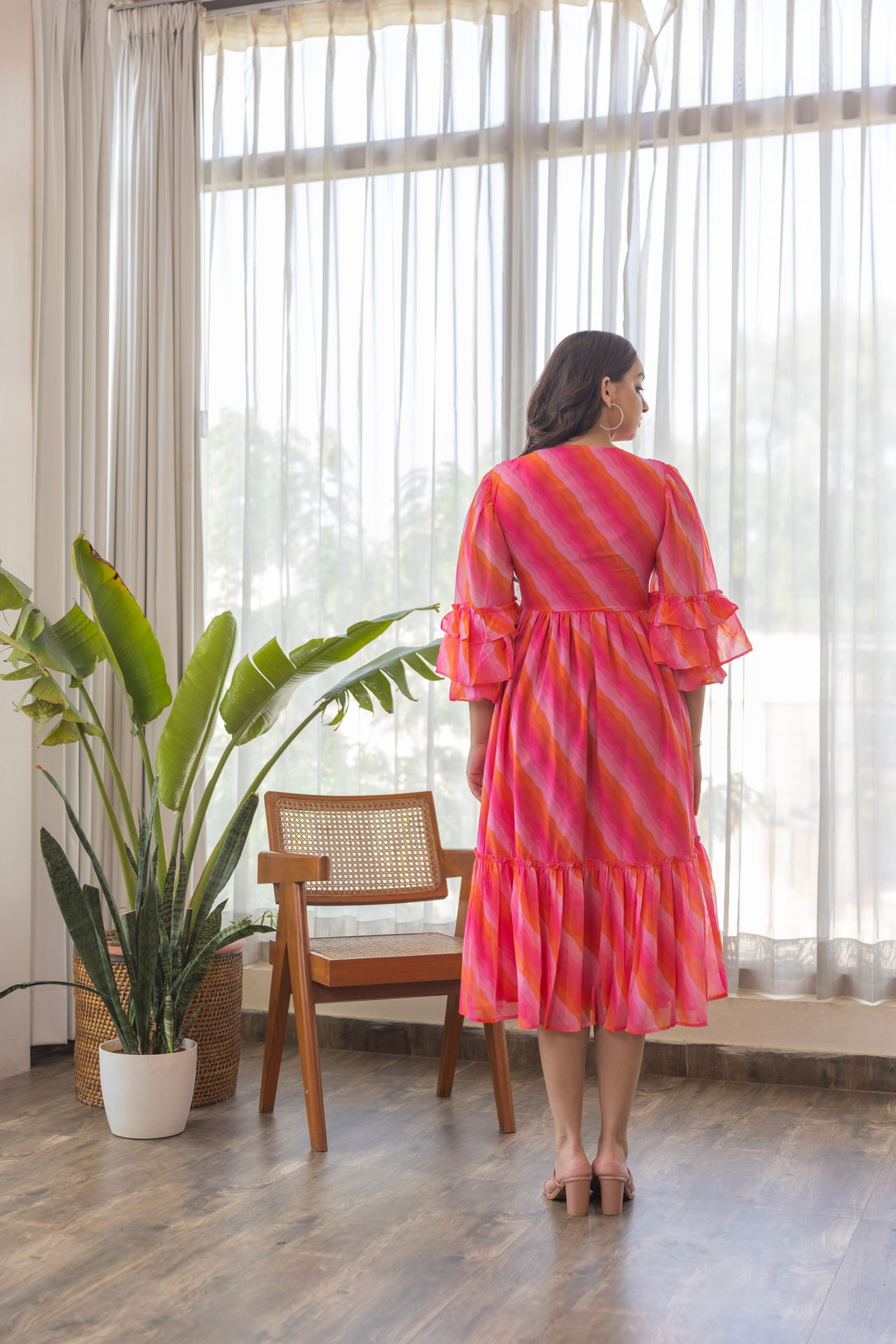 Model wearing PINK WAVE NURSING MAXI dress in bright colors.
