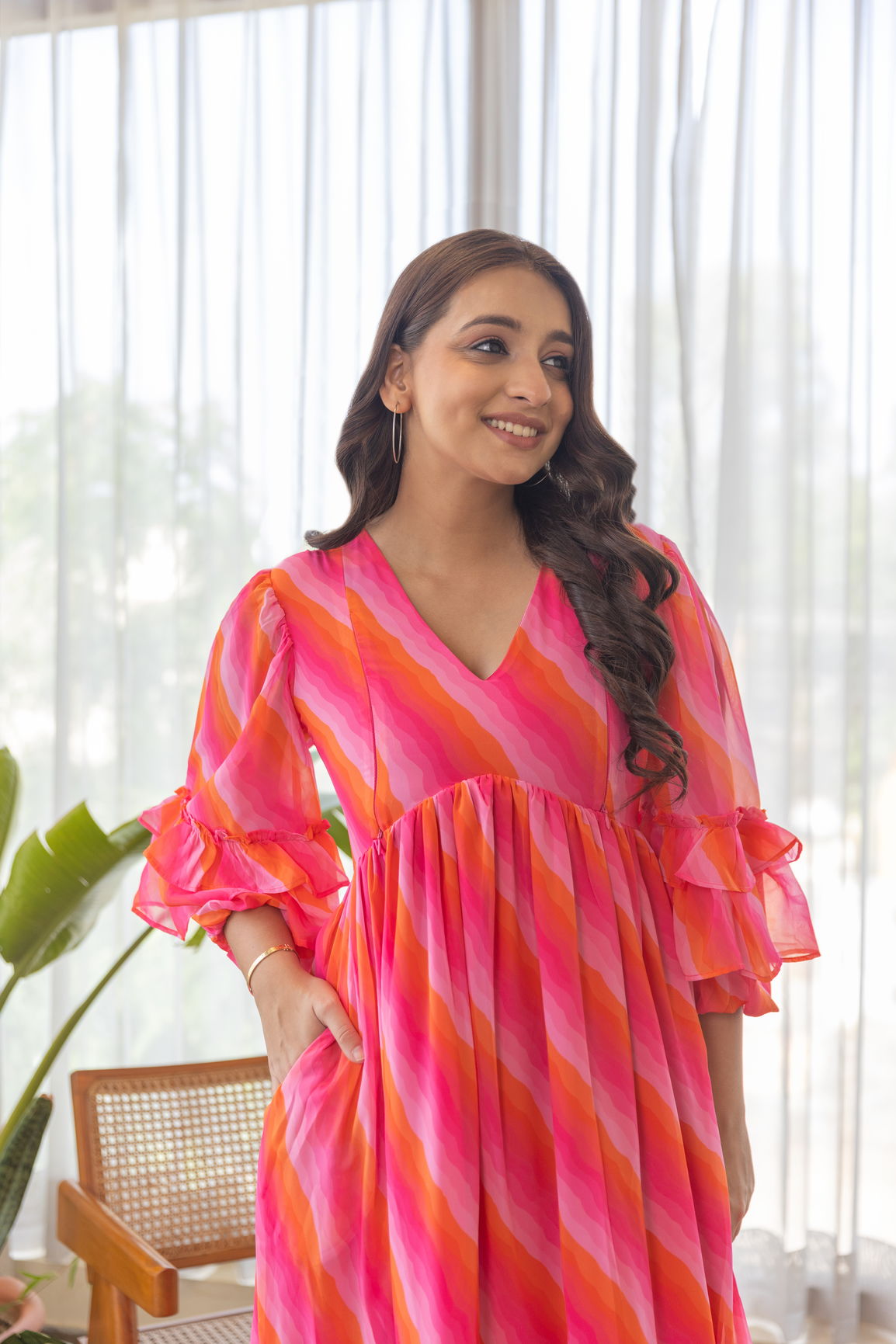 Stylish woman wearing the Pink Wave Nursing Maxi dress.
