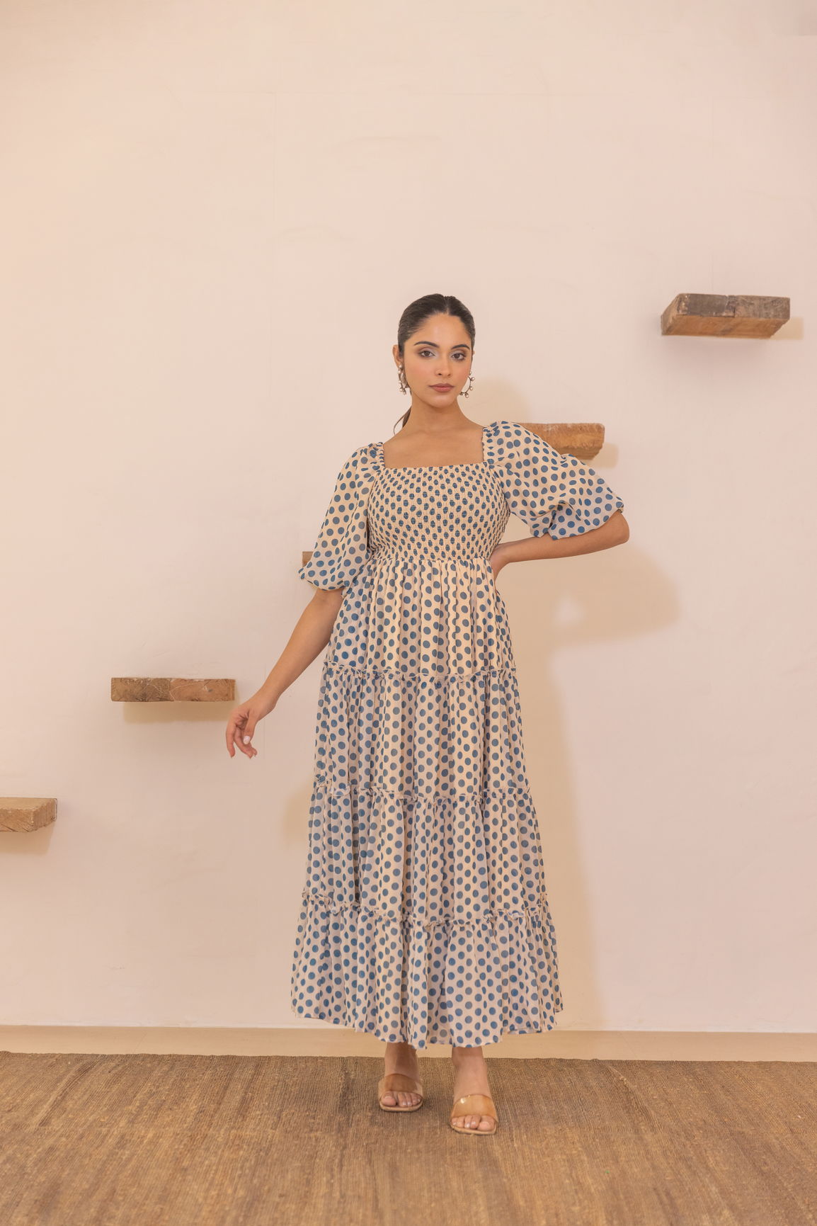 Polka smocked maxi dress with puff sleeves and tiered design.