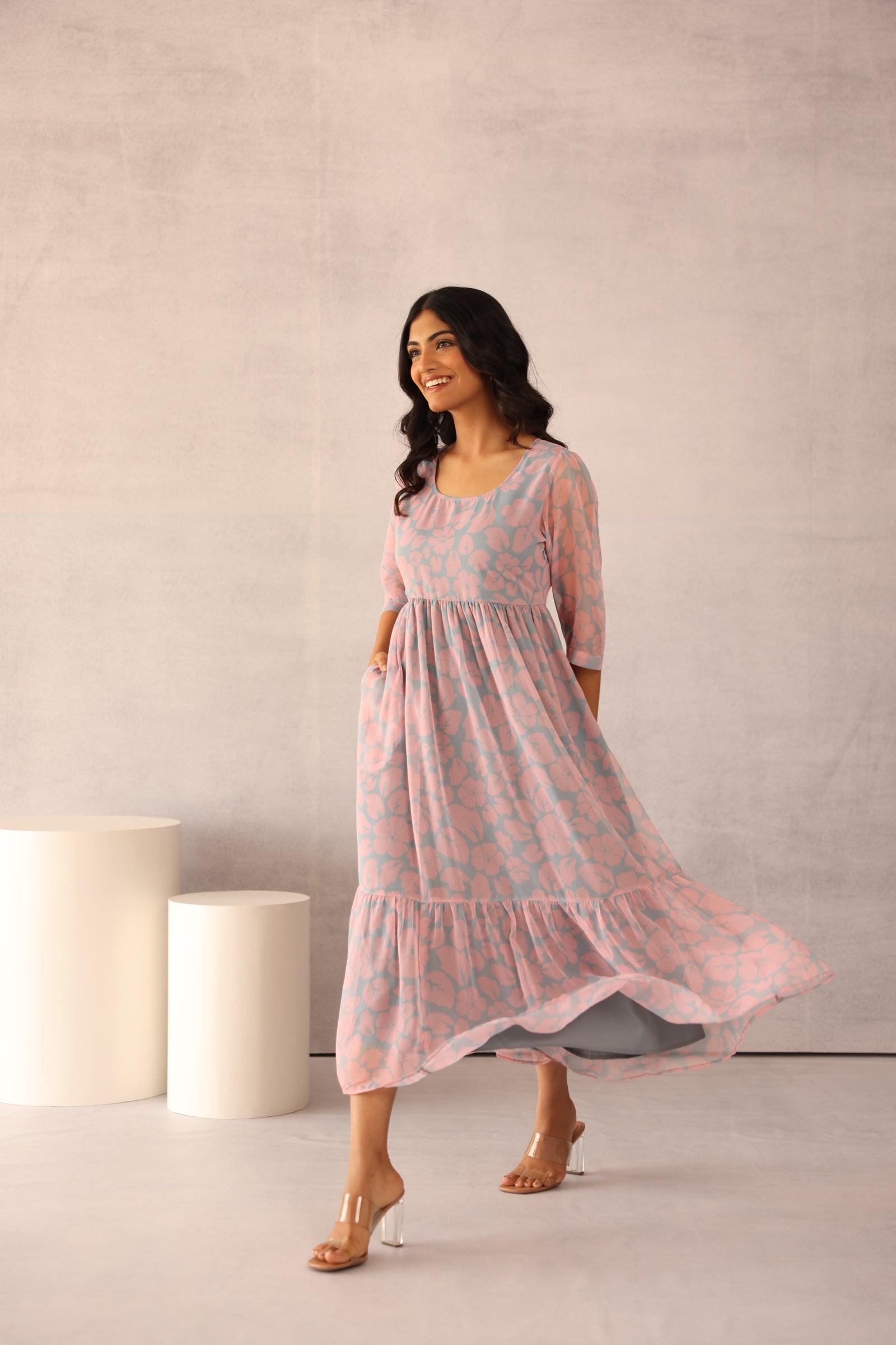 Elegant grey and pink maxi dress with floral design.