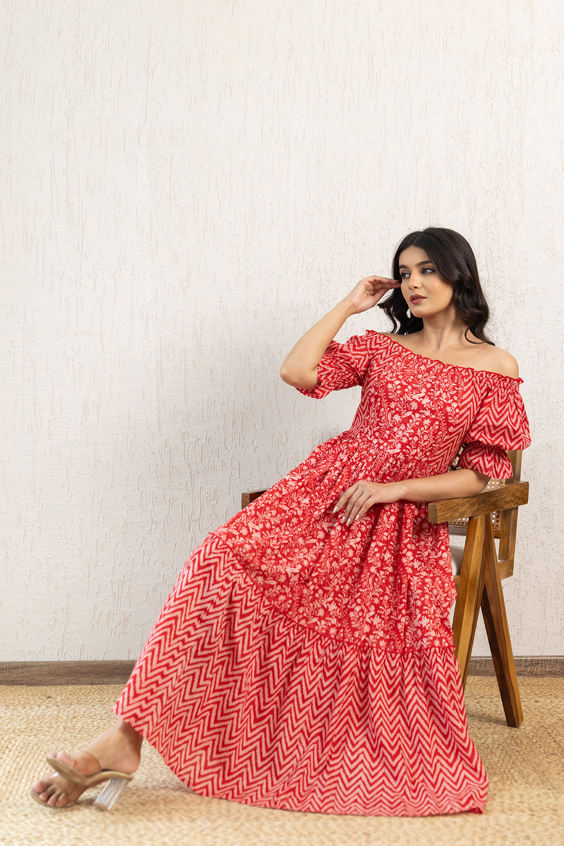 Red off-shoulder cotton maxi dress styled elegantly on a model.