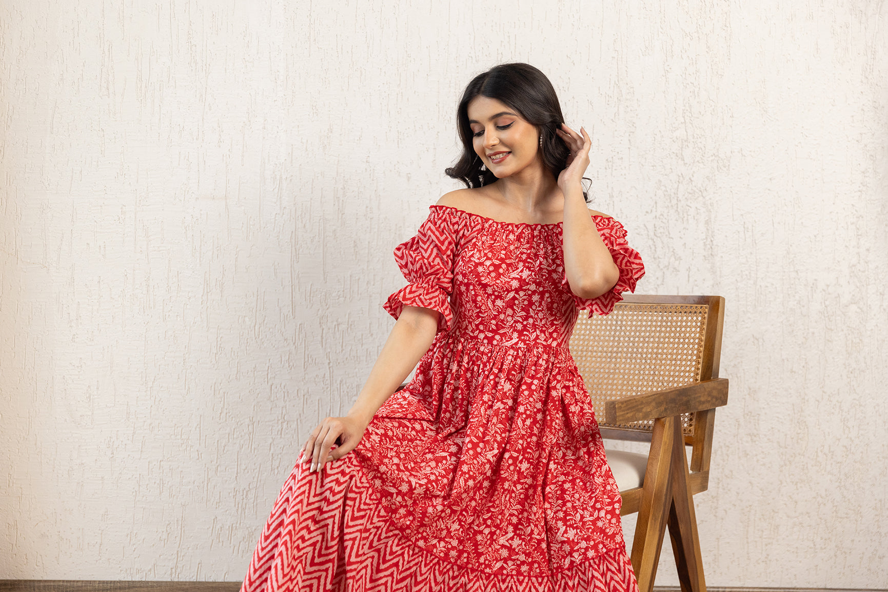 Red off-shoulder cotton maxi dress displayed on a model.