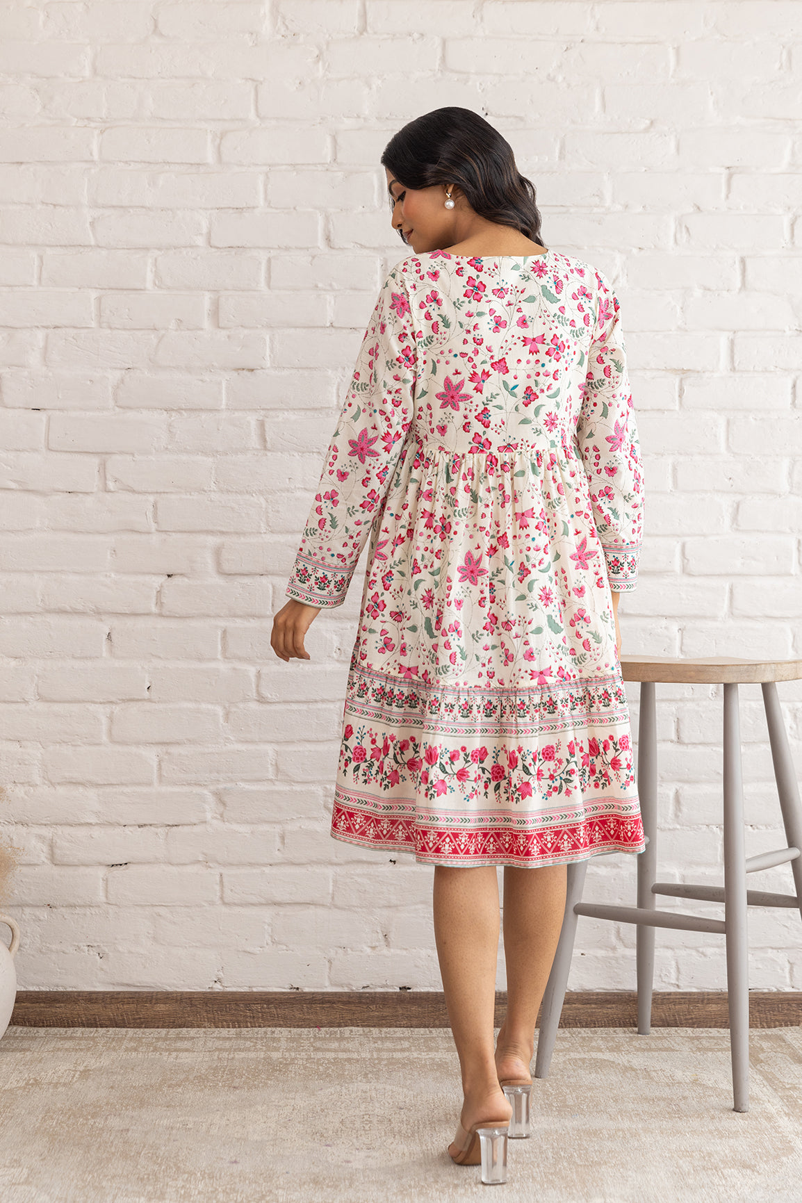 Floral cotton midi dress for women, back view on white brick wall