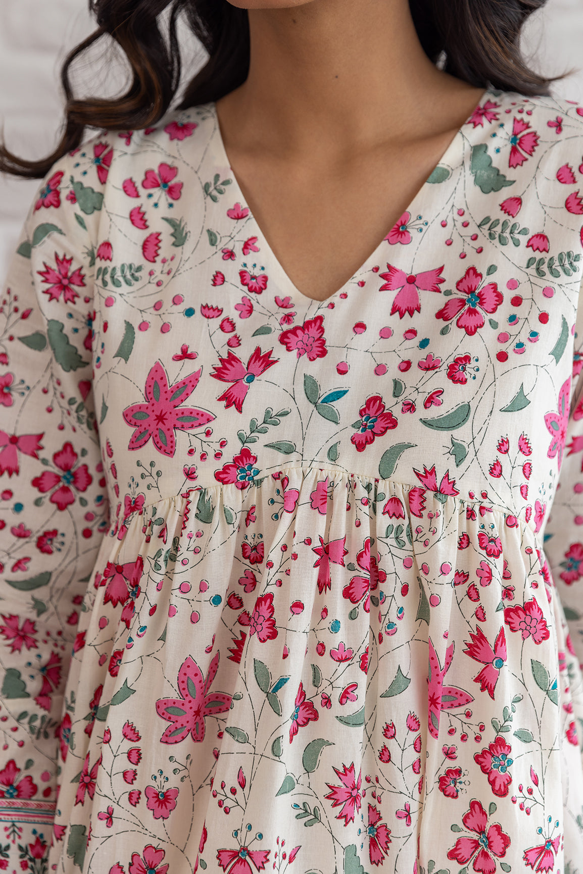 Cotton midi dress with vibrant floral print and V-neck design.