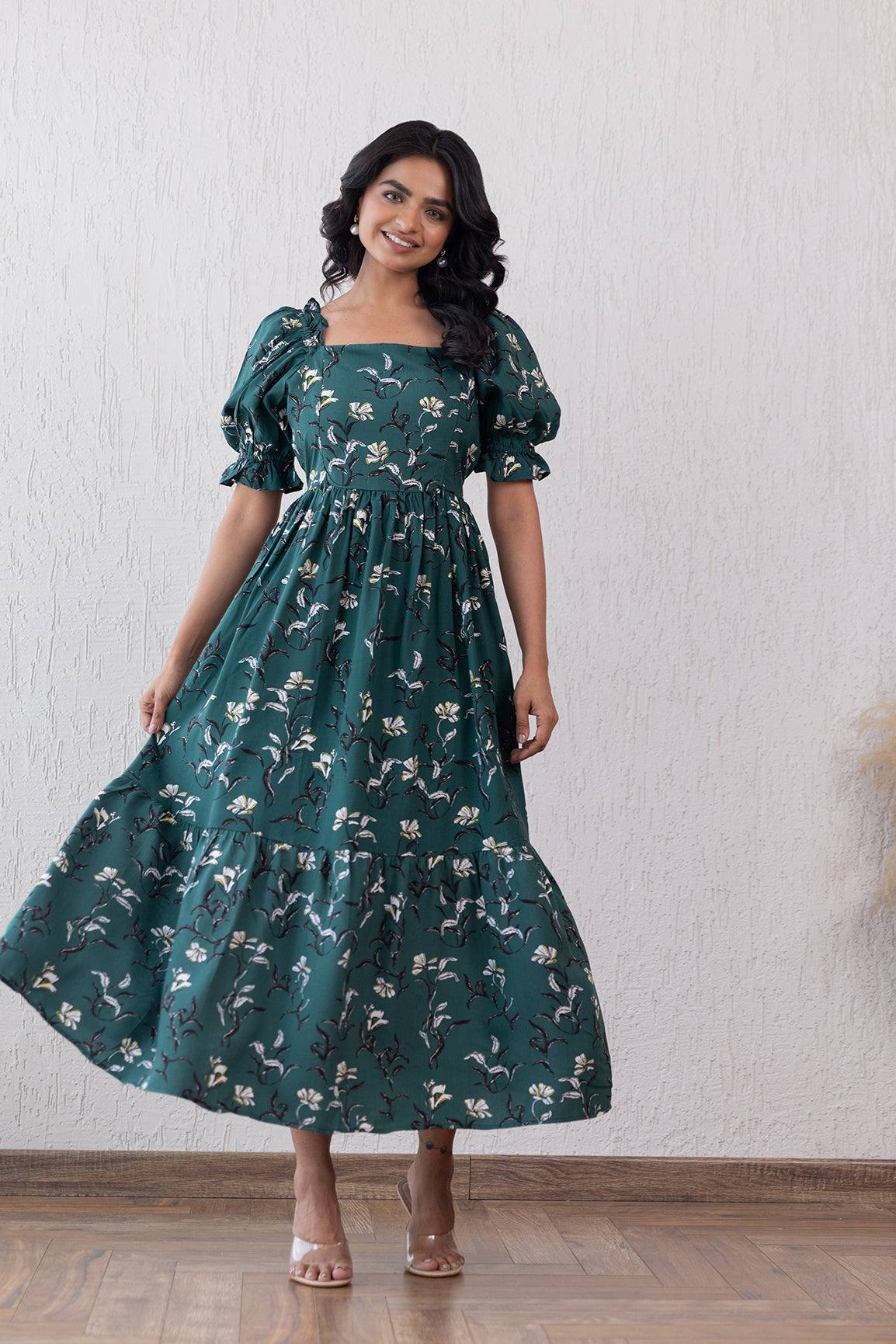 Green cotton nursing maxi dress with floral patterns and balloon sleeves.