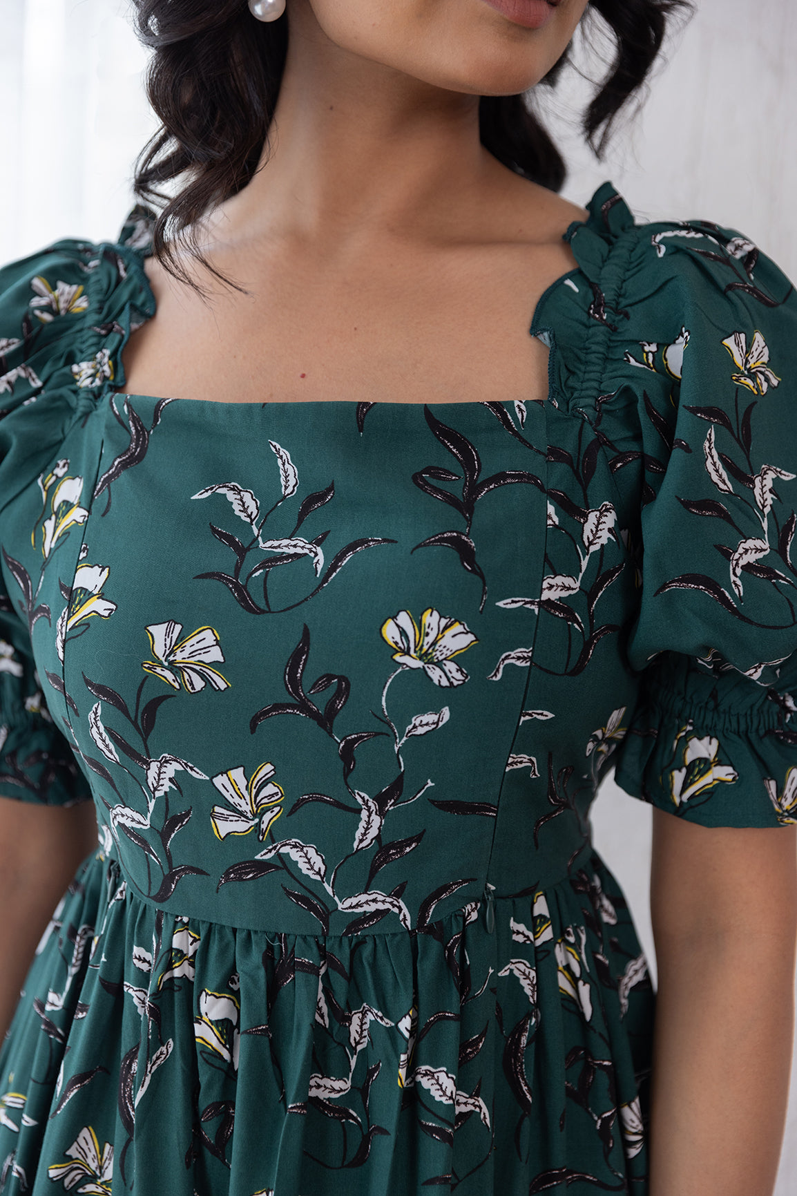Green cotton nursing maxi dress with floral pattern and puff sleeves.