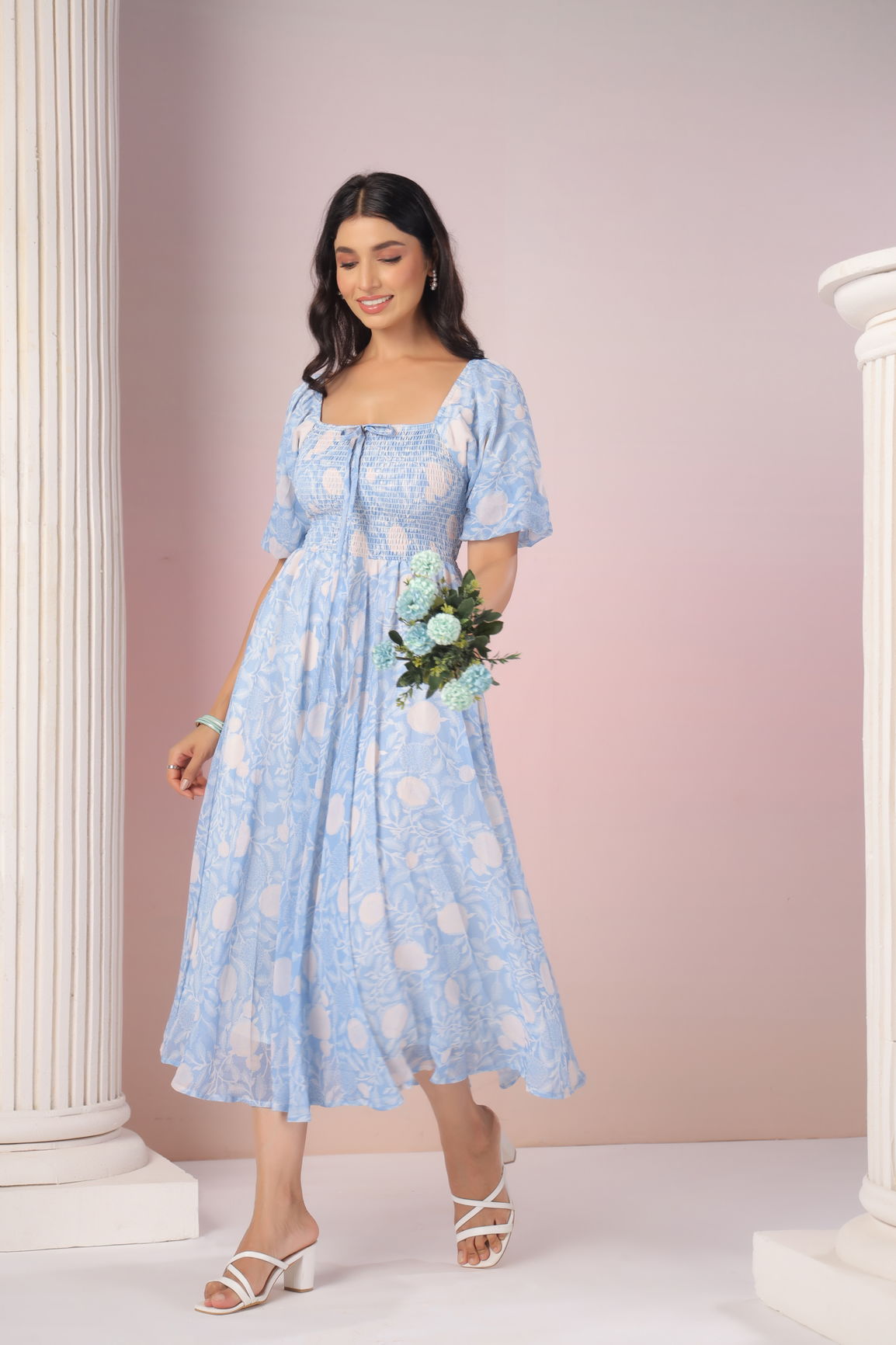 Elegant sky blue and cream maxi dress with floral design.