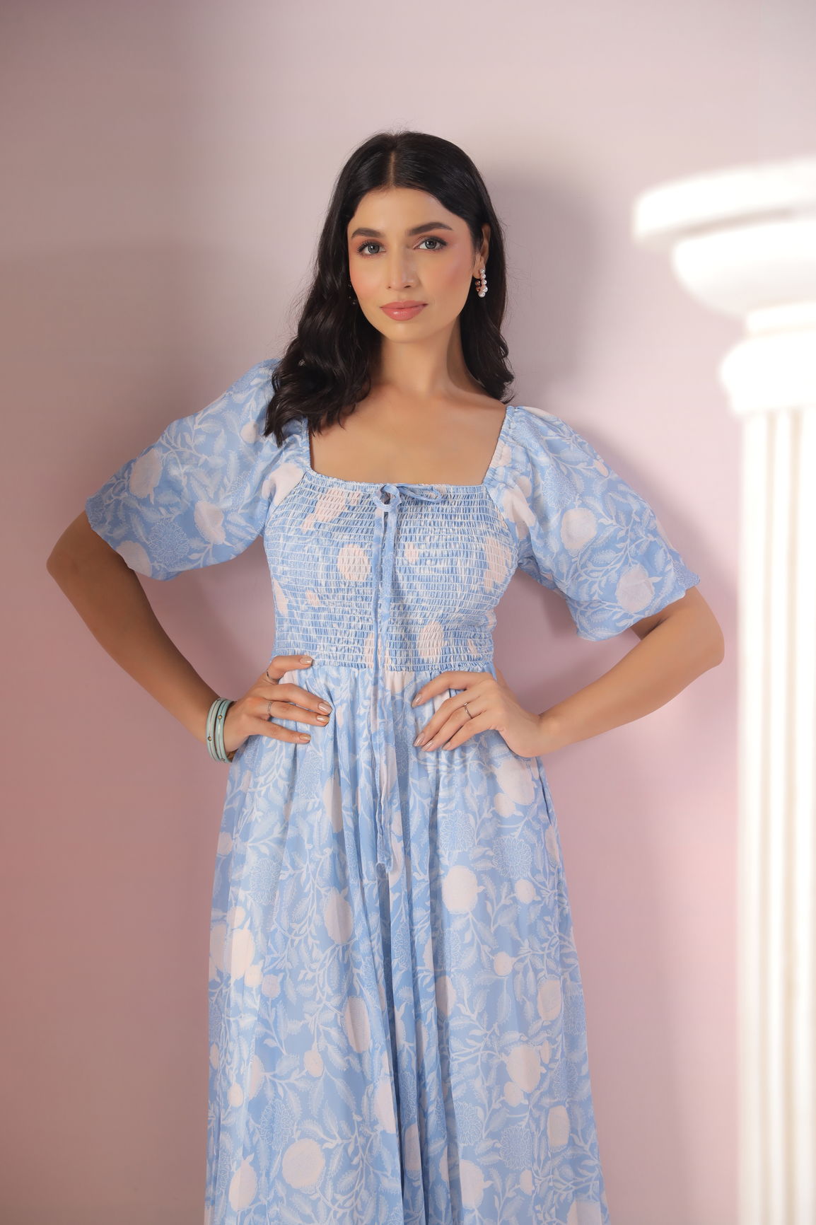 Sky blue and cream maxi dress displayed by a model.