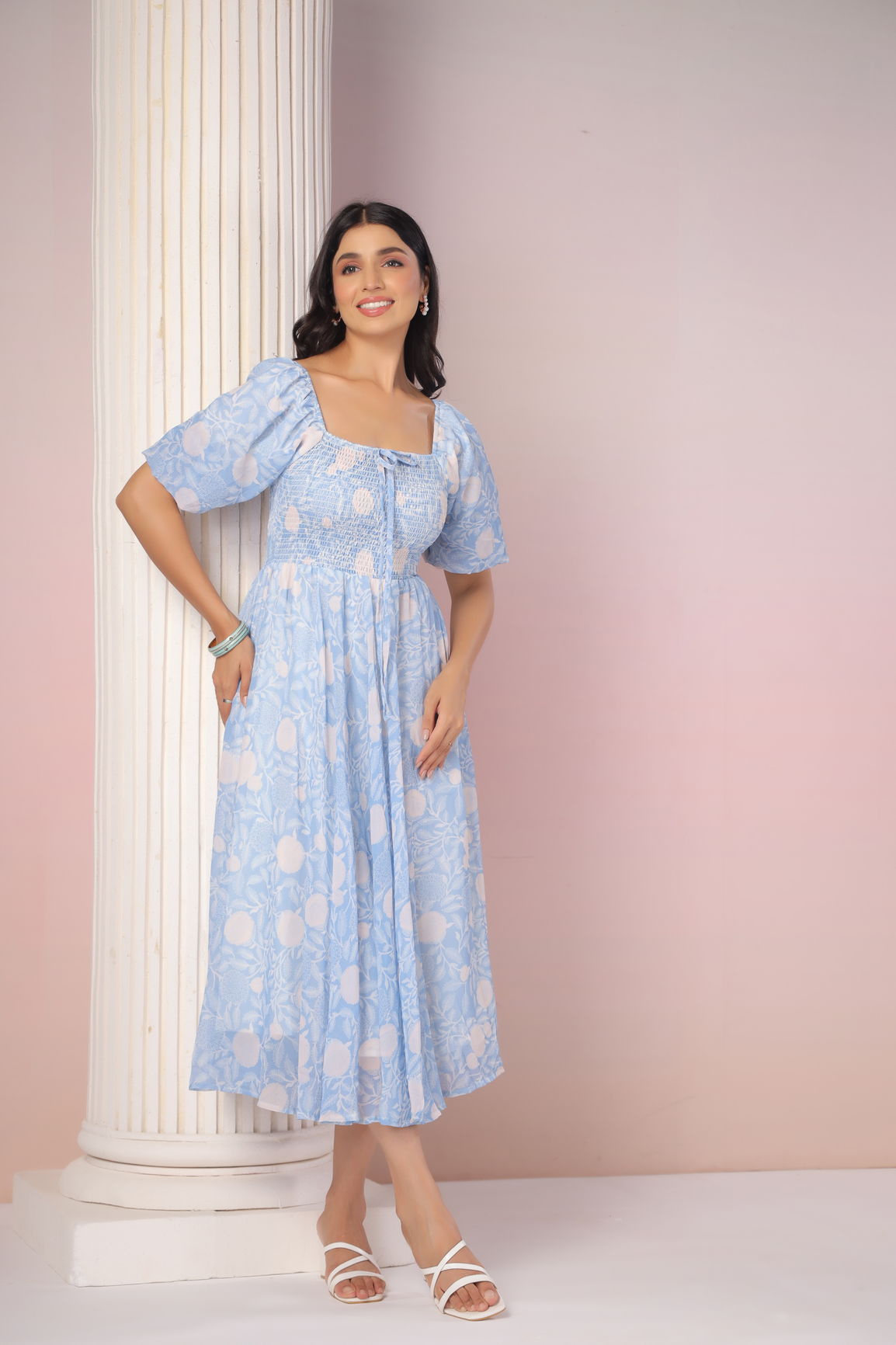 Sky blue and cream floral maxi dress with puff sleeves.