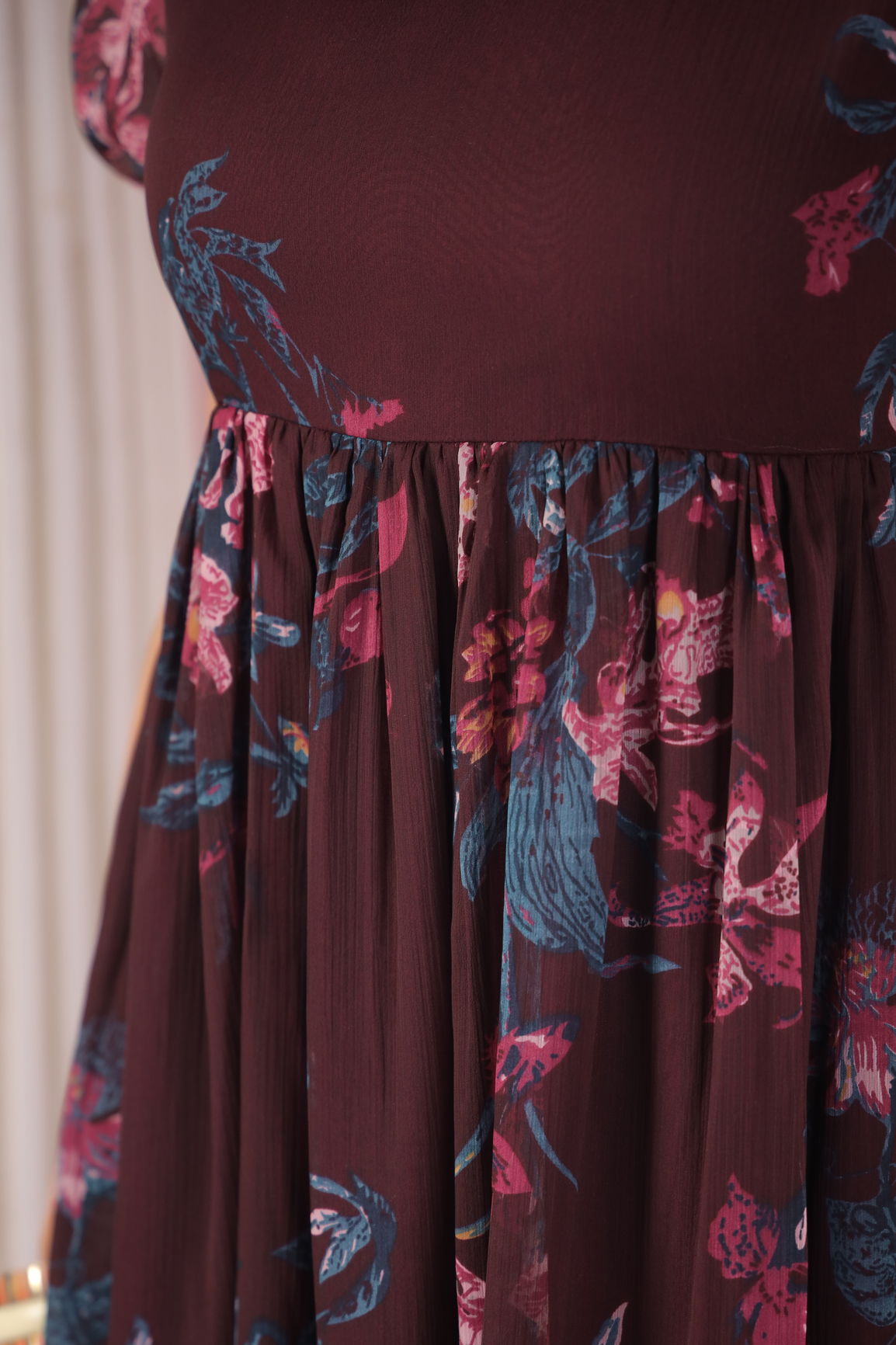 Wine floral maxi dress with vibrant flower print details.