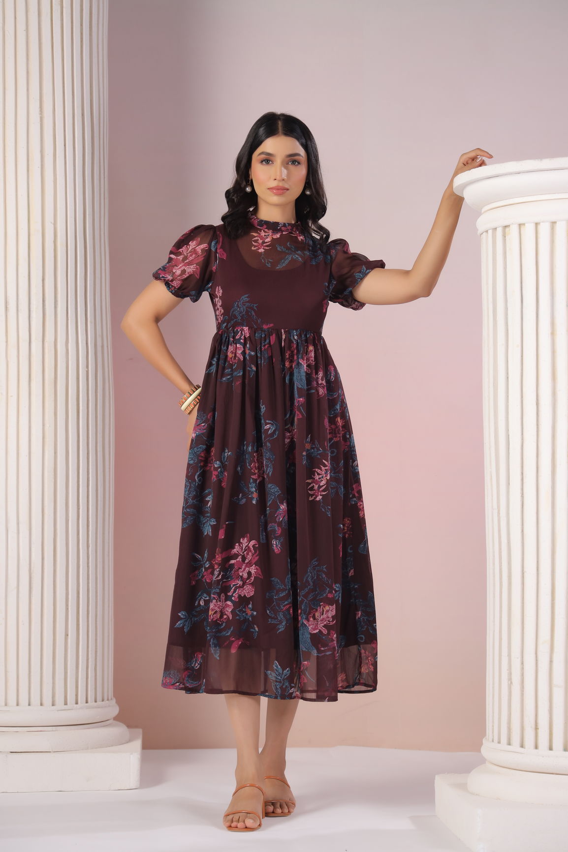 "Model wearing Wine Floral Maxi dress with puff sleeves and floral design."