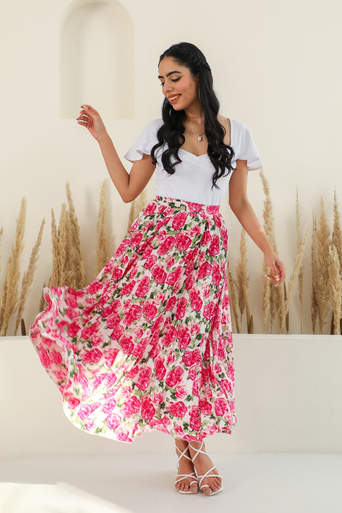 Elegant floral pleated co-ord outfit for stylish summer occasions.