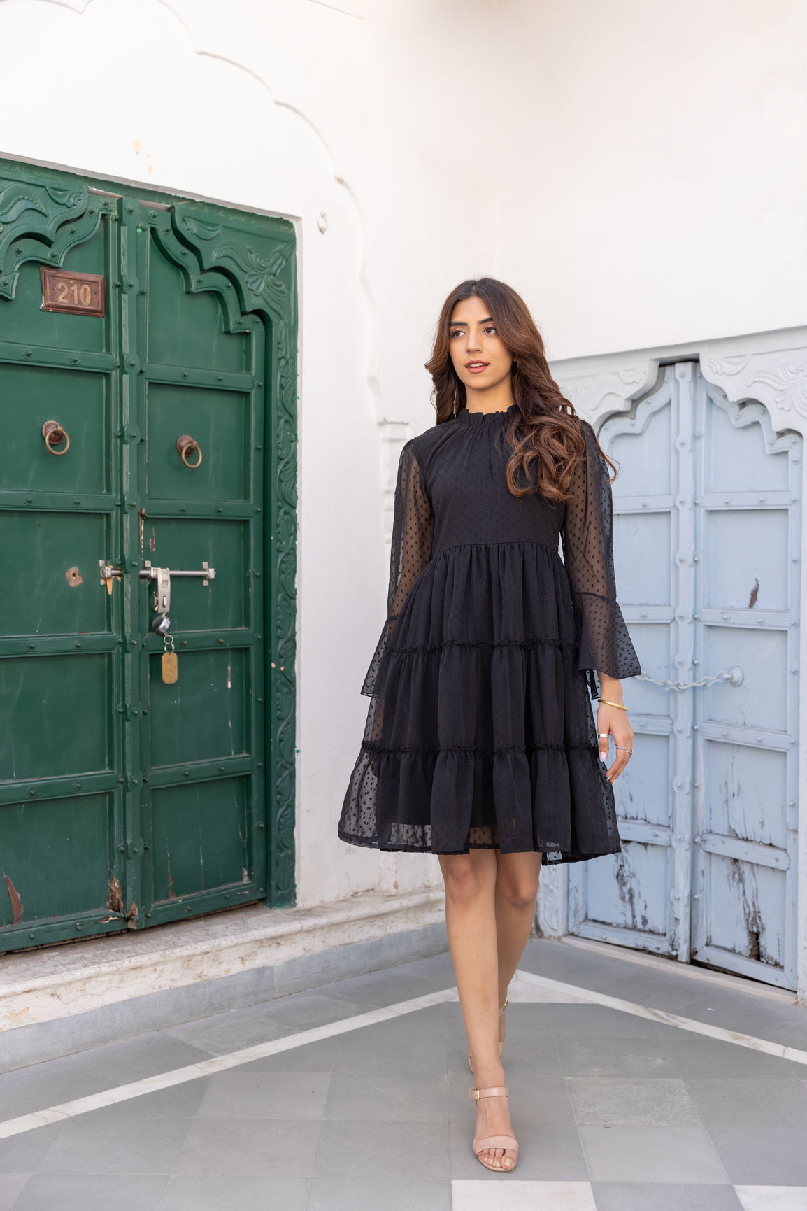 Elegant little black chiffon midi dress with tiered ruffles.