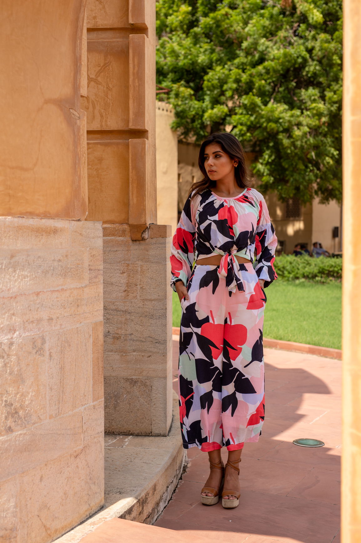Stylish woman wearing a vibrant MOSAIC CO-ORD SET outdoors.