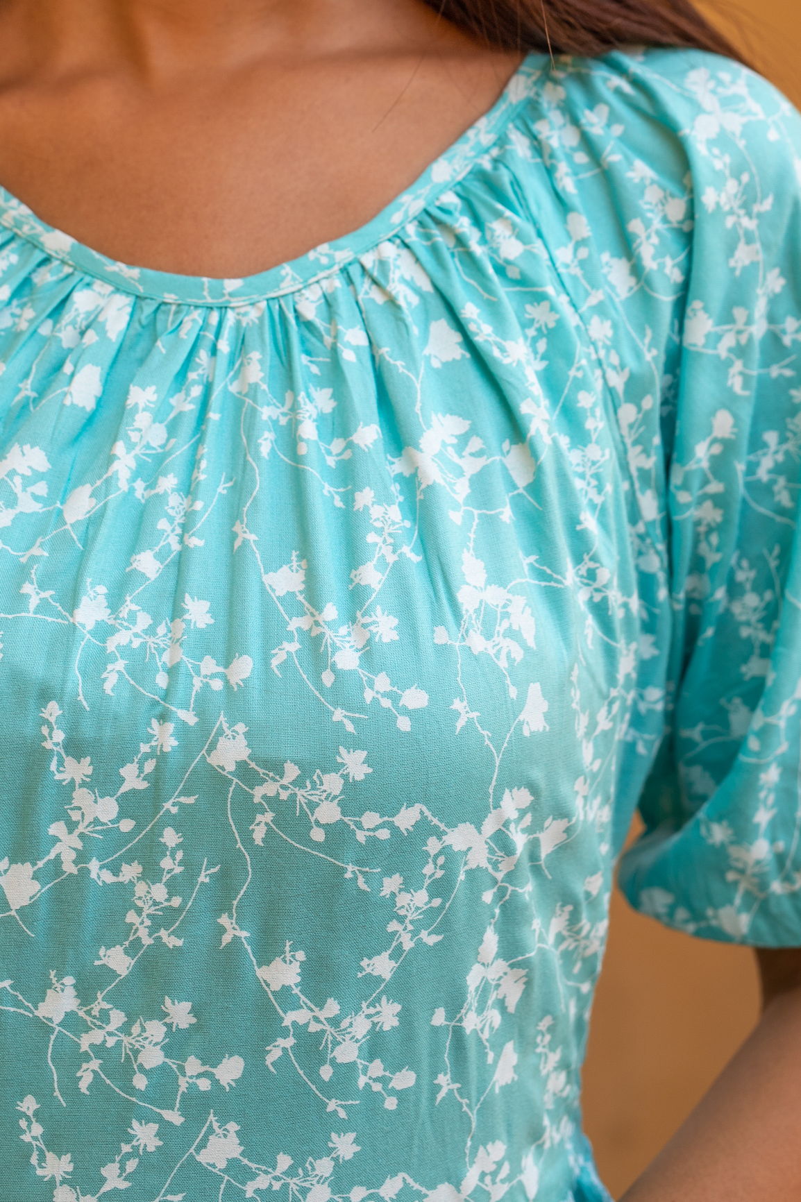 Sea blue floral maxi dress with elegant floral design.
