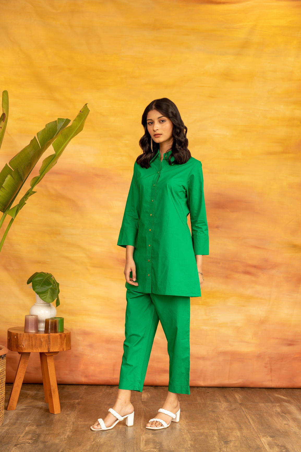 Model showcasing a vibrant green shamrock co-ord set outfit.