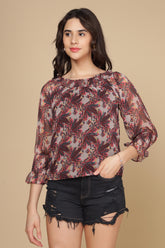 Multi off-shoulder top with floral pattern and bell sleeves.