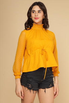 Stylish yellow chiffon top with polka dots and tie detail.