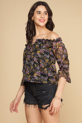 Off-shoulder multi floral top with stylish ruffled sleeves.