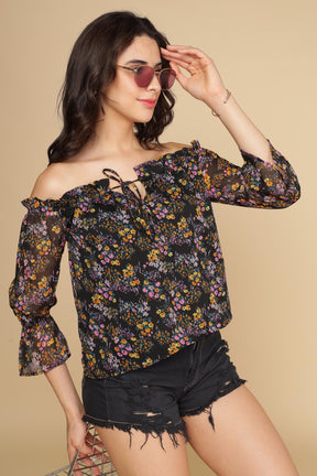 Multi floral off-shoulder top with stylish bell sleeves.