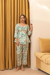 Beige abstract satin co-ord outfit with floral design, stylish and chic.