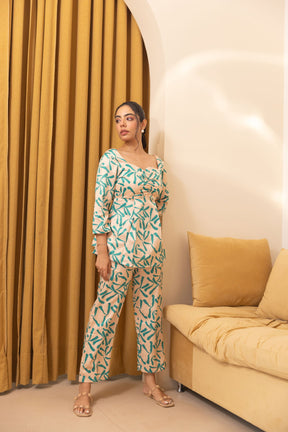 Beige abstract satin co-ord set worn by a model indoors.