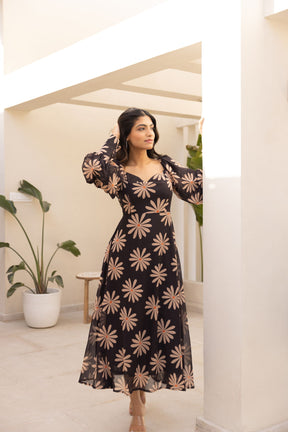 Black balloon sleeve dress with floral print, elegant summer fashion.