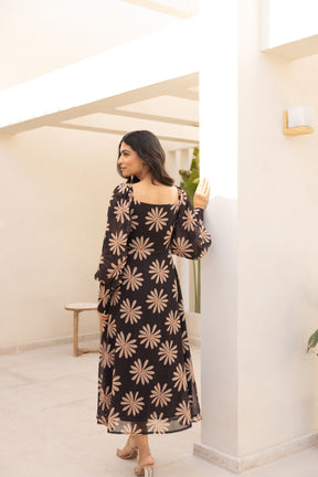 Black balloon sleeve dress with floral pattern, elegant and stylish.