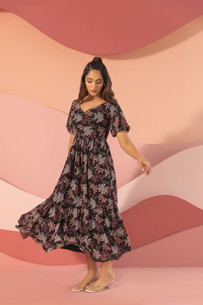 Black floral maxi dress model showcasing elegant summer style.