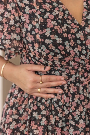 Black floral print nursing maxi dress with stylish detailing.